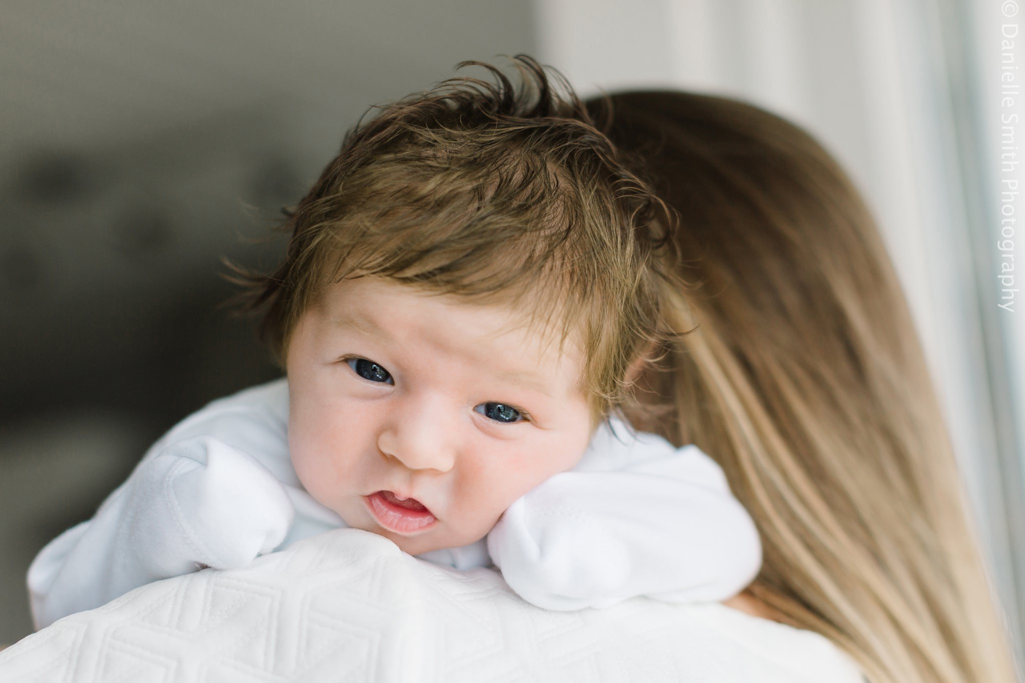 baby on mums shoulder - Relaxed Newborn Baby Photography in South London