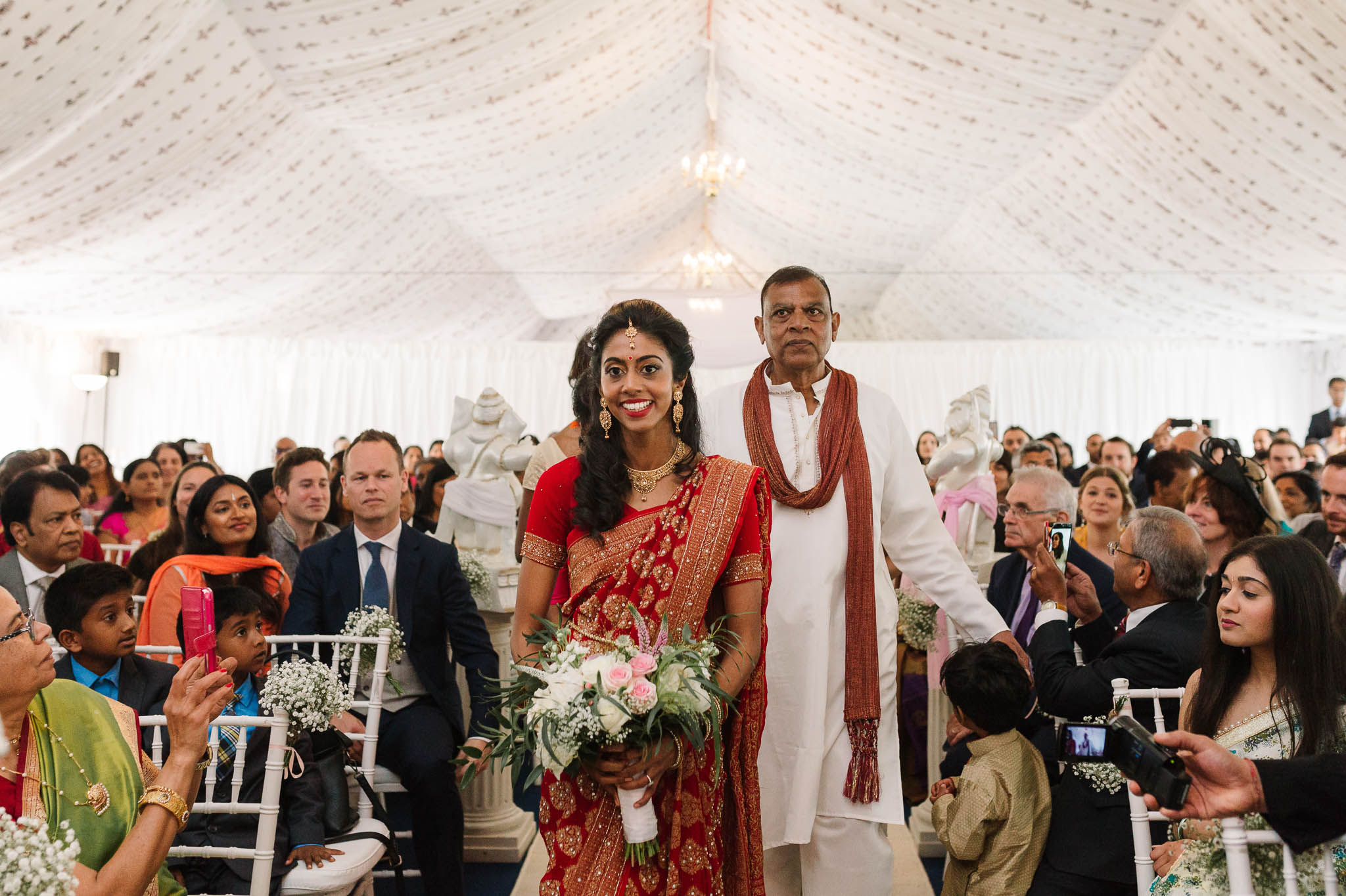 indian bride walking down the aisle
