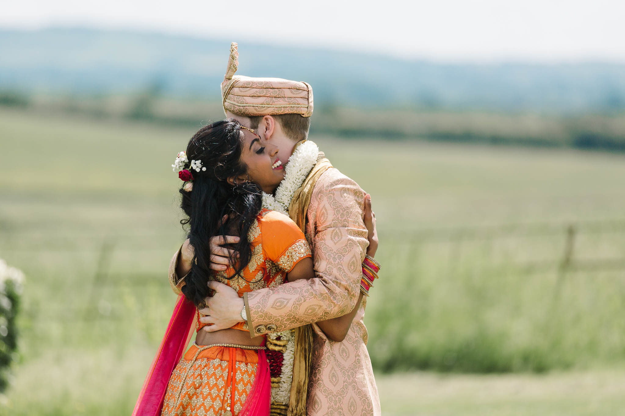 indina bride and groom hugging