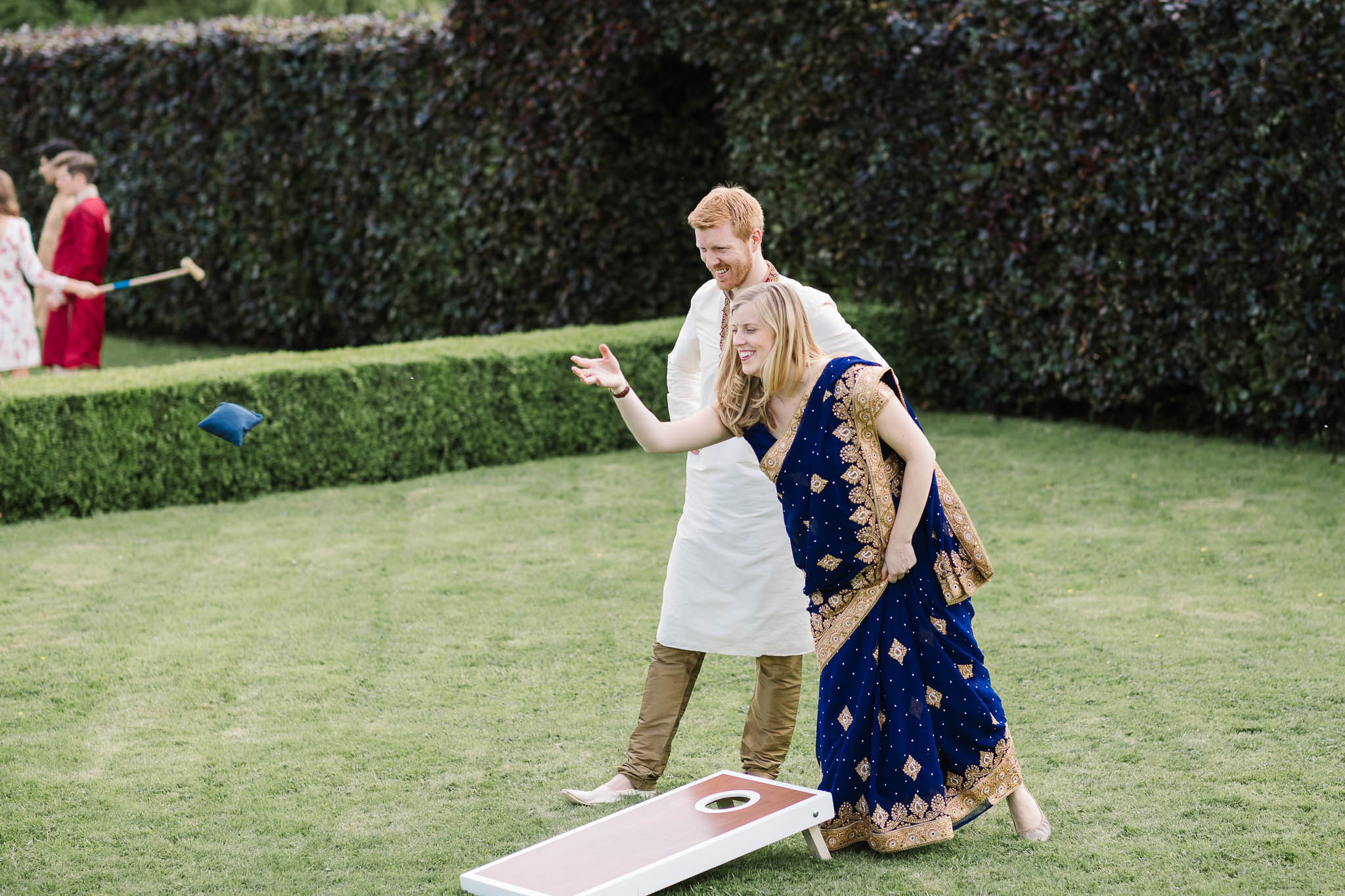 couple playing garden games at wedding