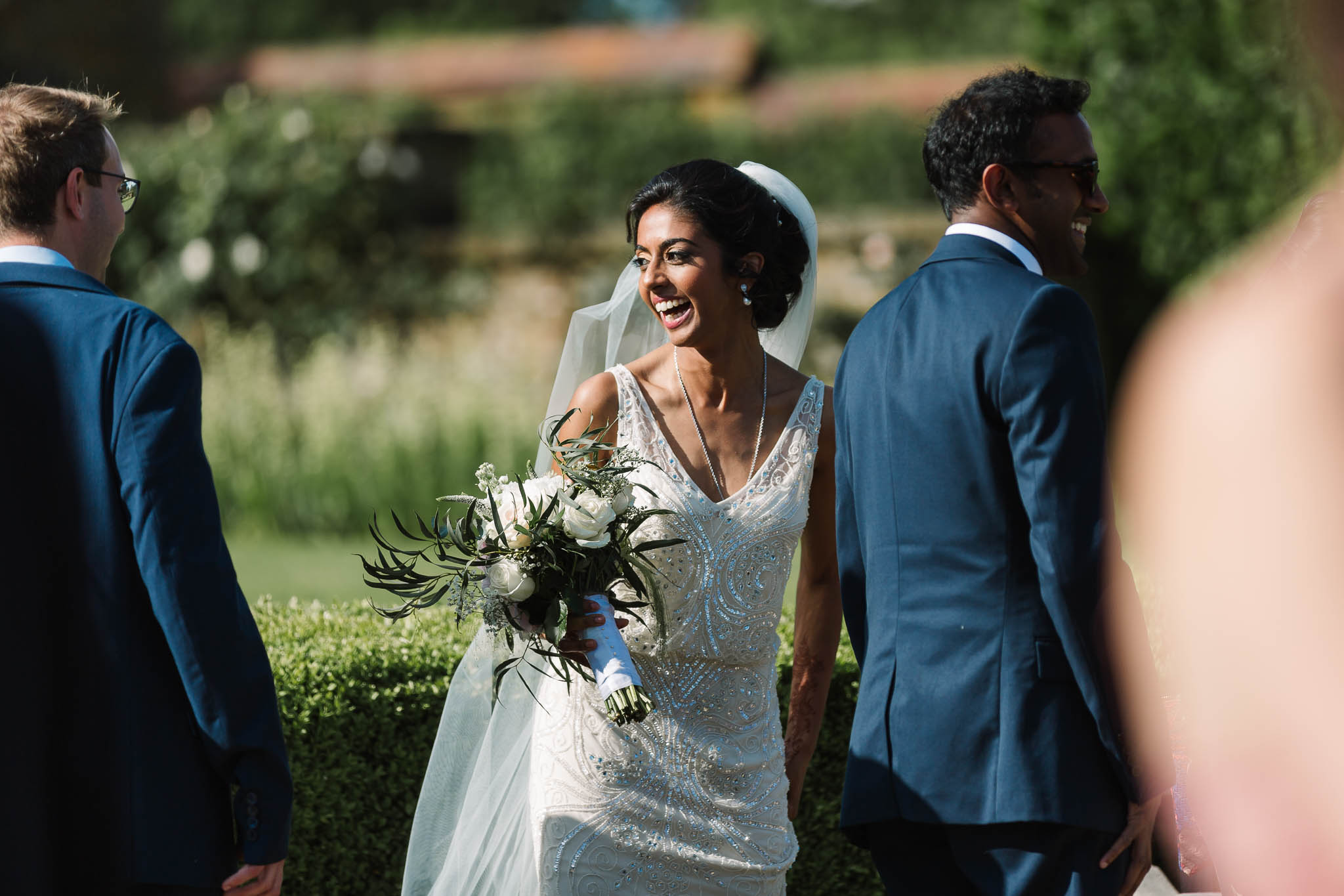 bride laughing in sun