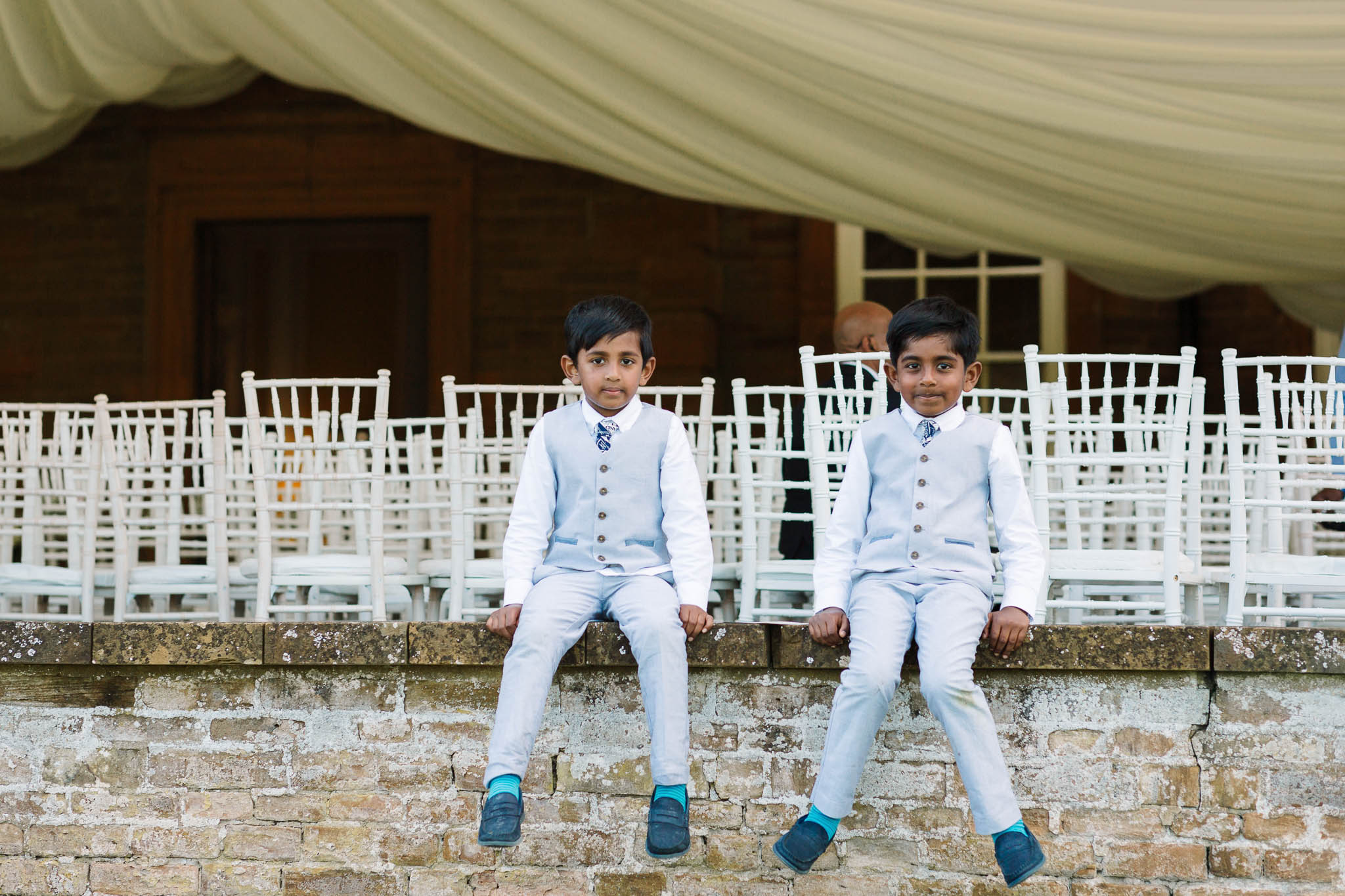 page boys sitting on wall