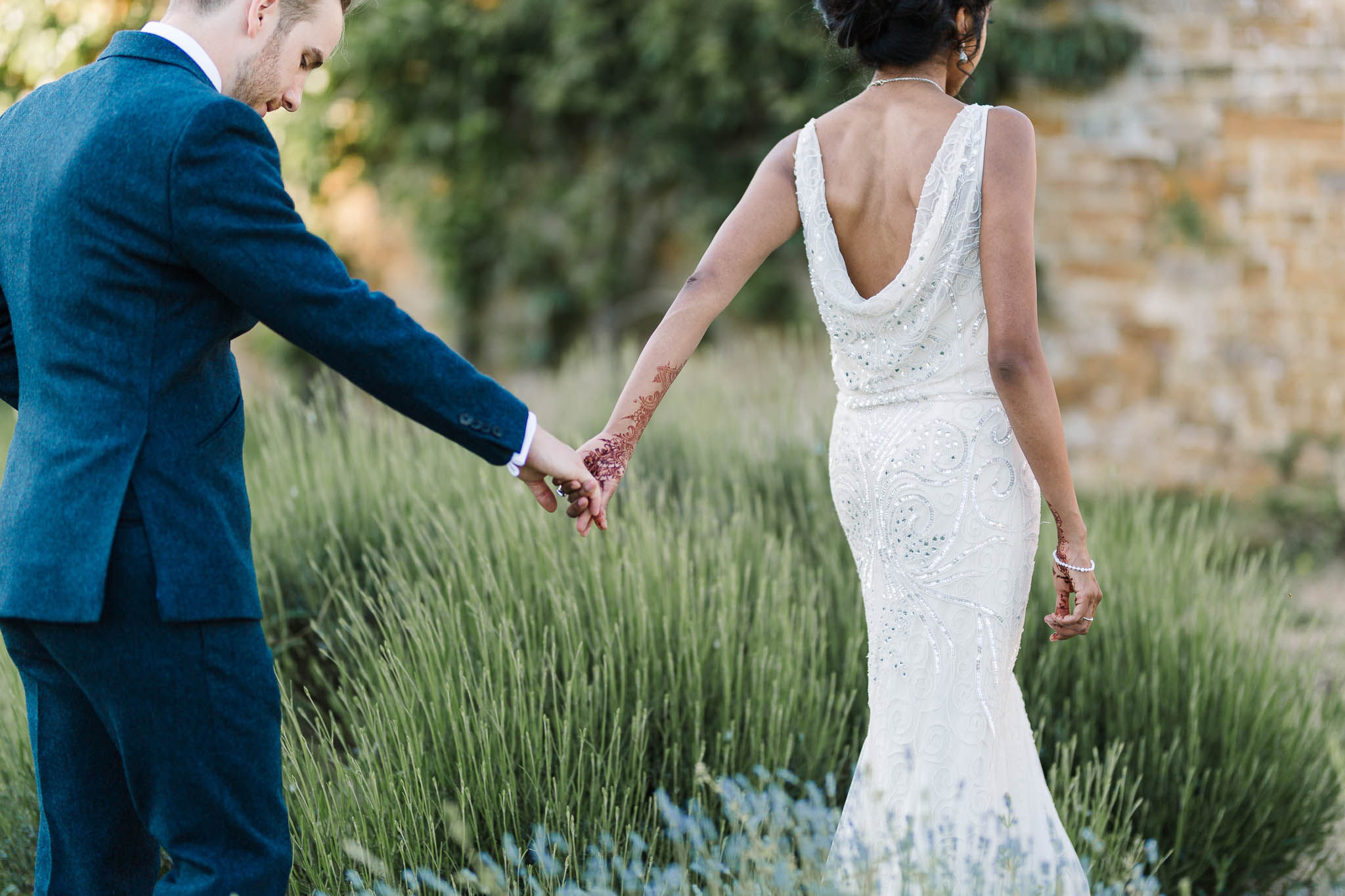 brie and groom holding hands
