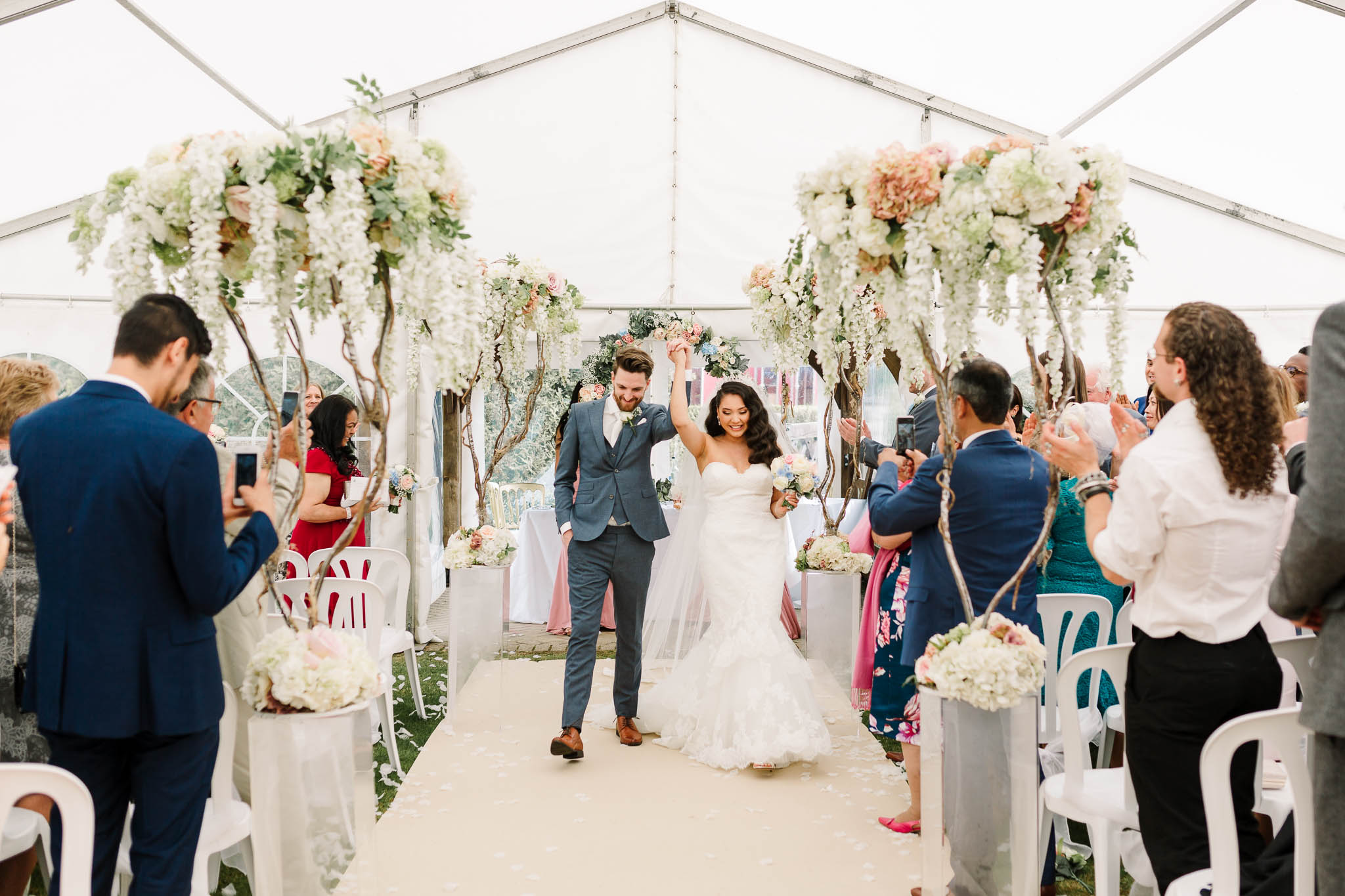 bride and groom walking down aisle at brewerstreet farmhouse wedding