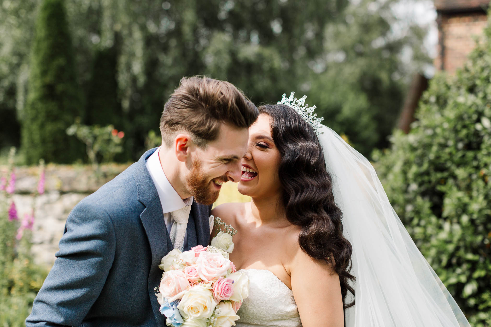 bride and groom laughing at fun and relaxed summer wedding