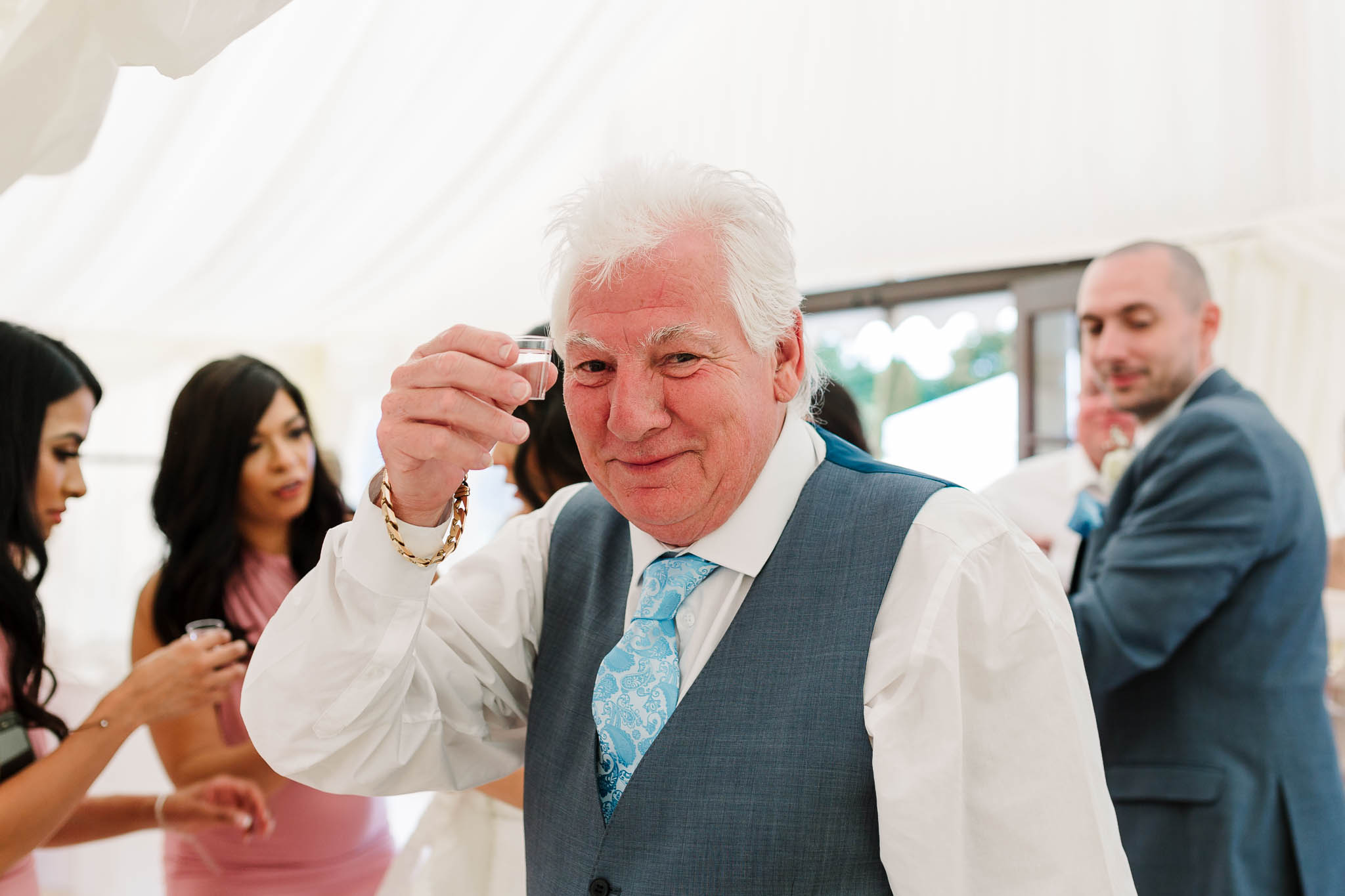 wedding guests doing shots