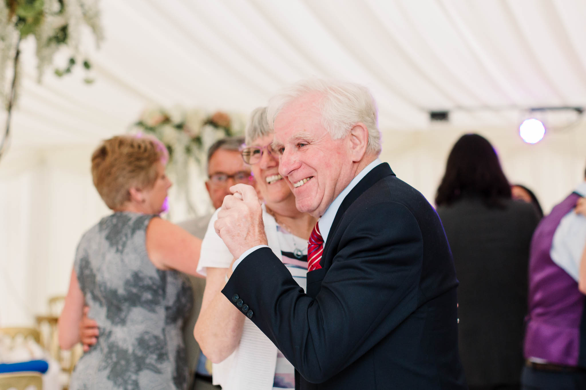 older guests dancing at wedding