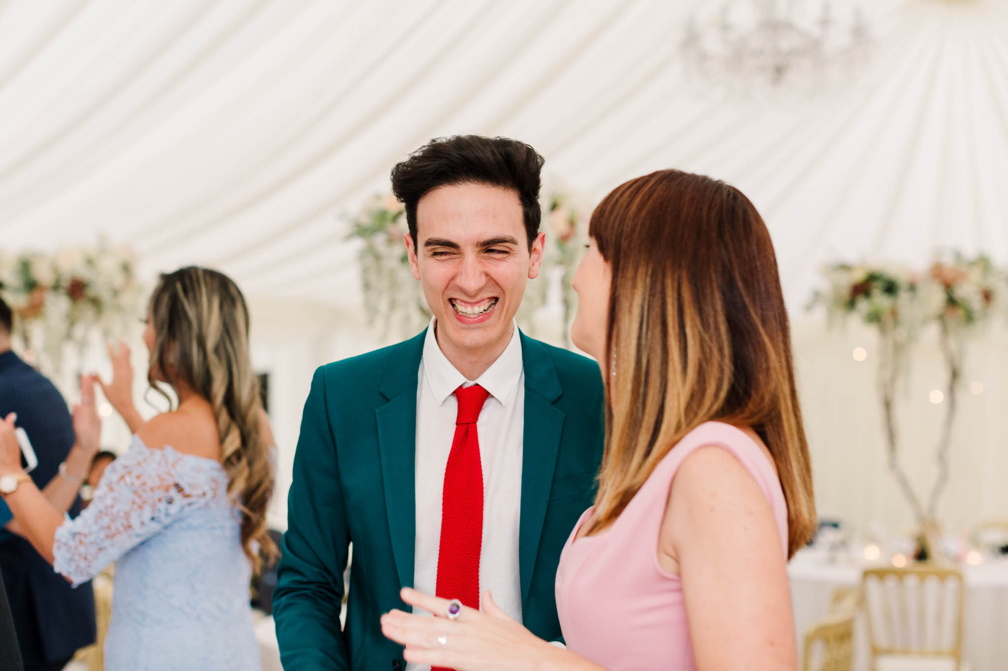 wedding guests laughing