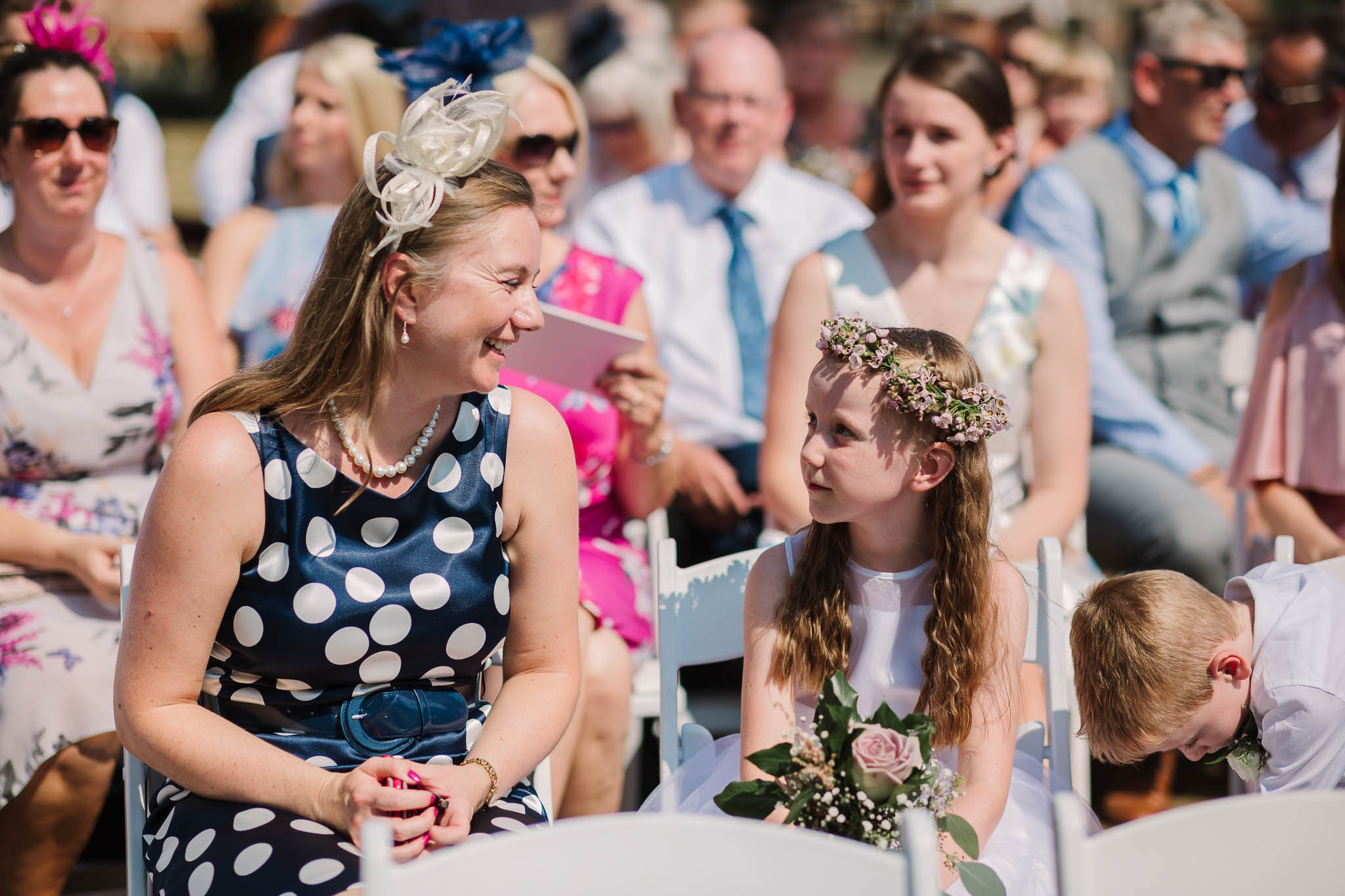 flower girl and mum at outdoor ceremony
