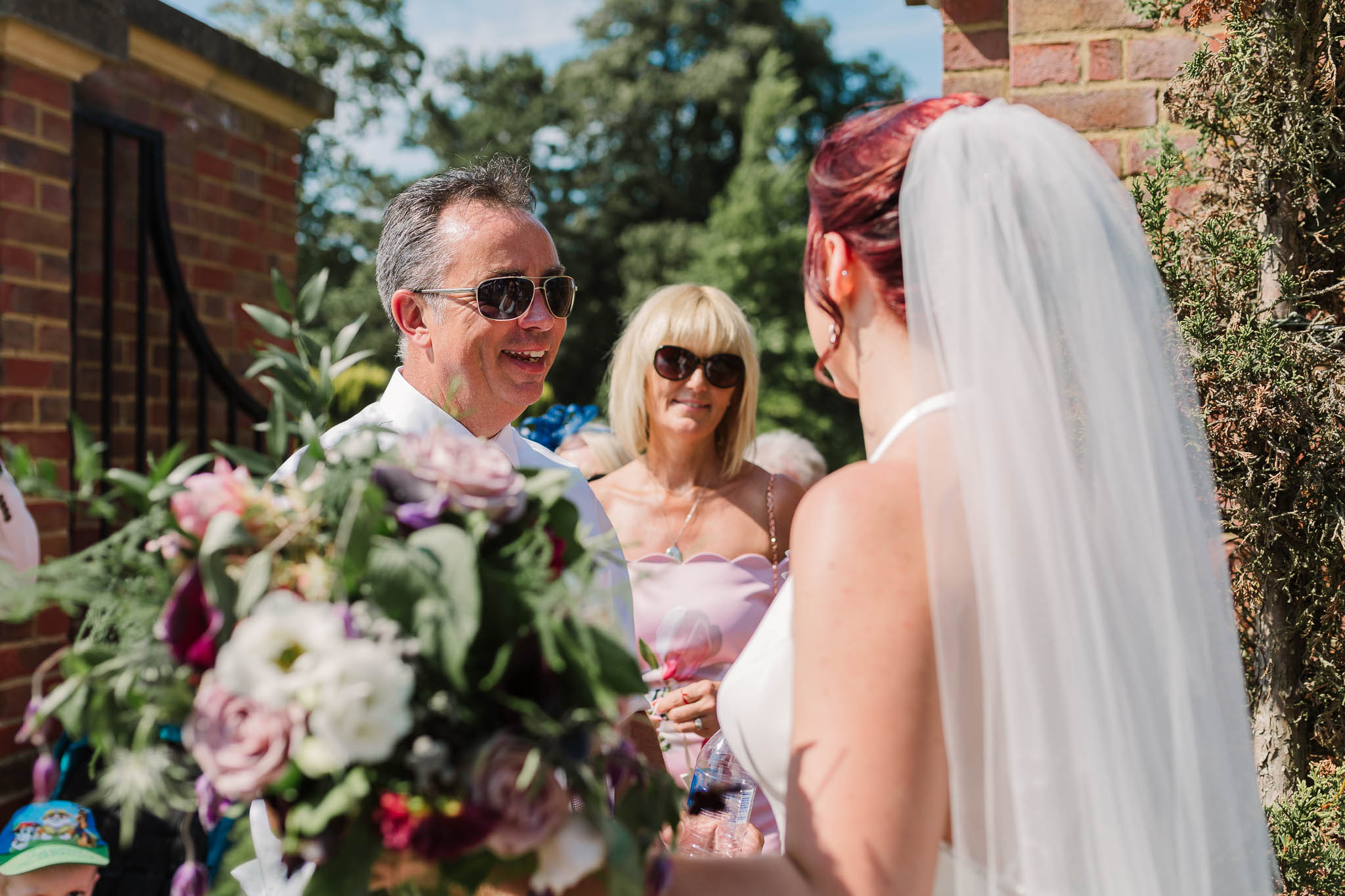 bride chatting with wedding guests