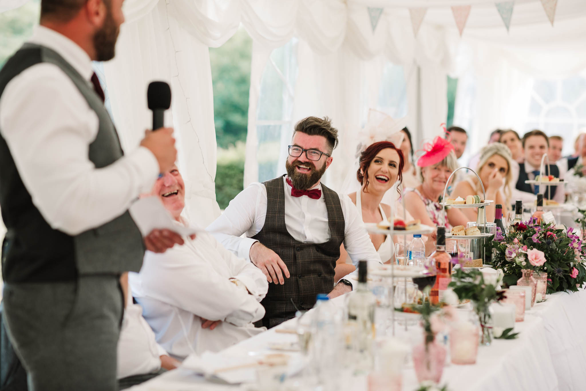 top table laughing at best mans speech
