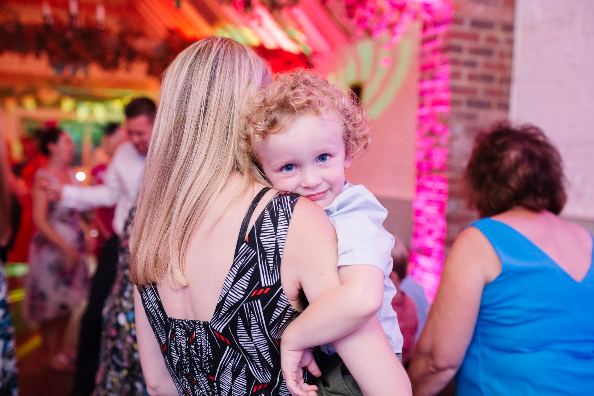 little boy on mums shoulder