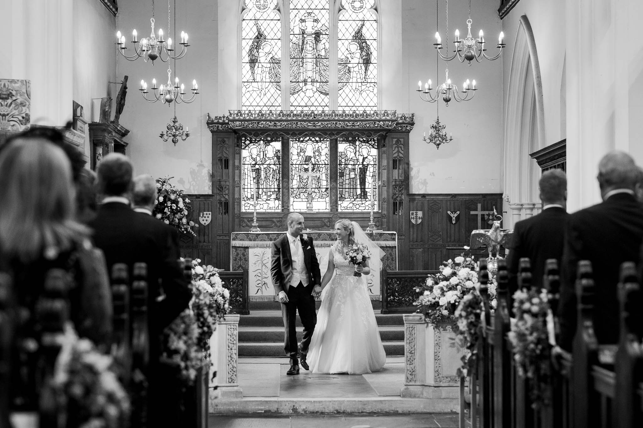 bride and groom about to walk down the aisle