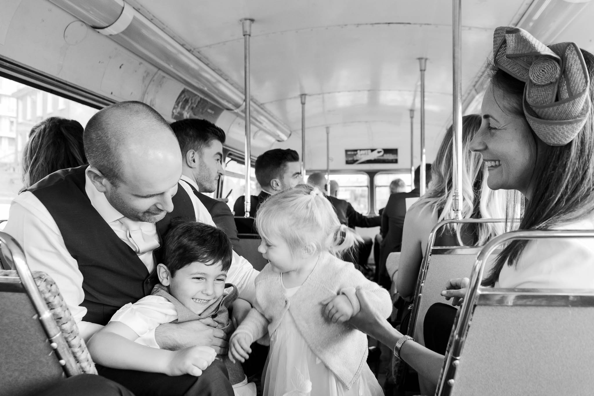 wedding guests on bus ride to venue