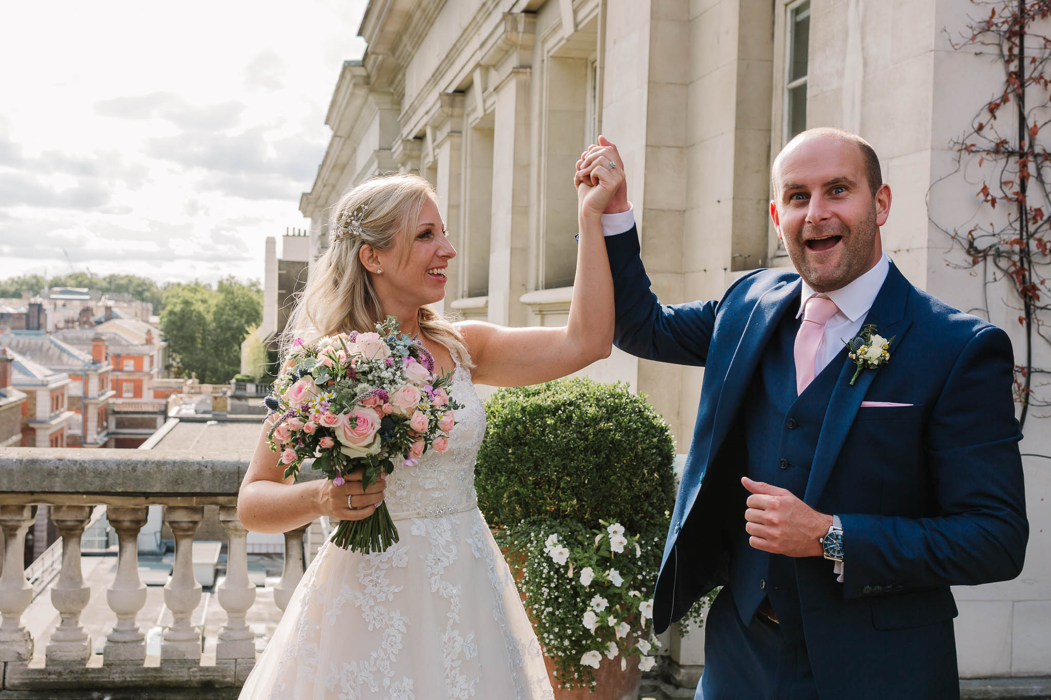 bride laughing with grooms twin brother