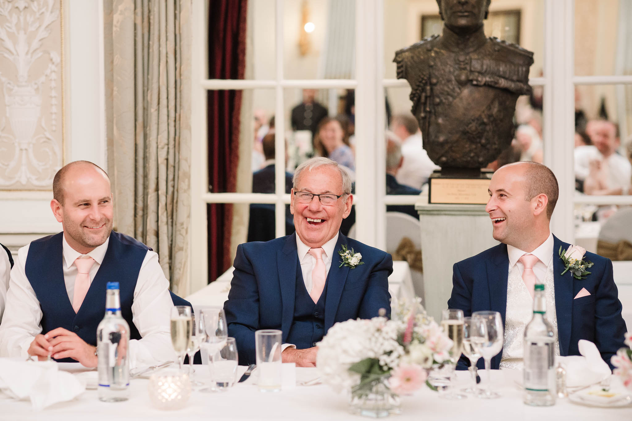 guys laughing during speeches