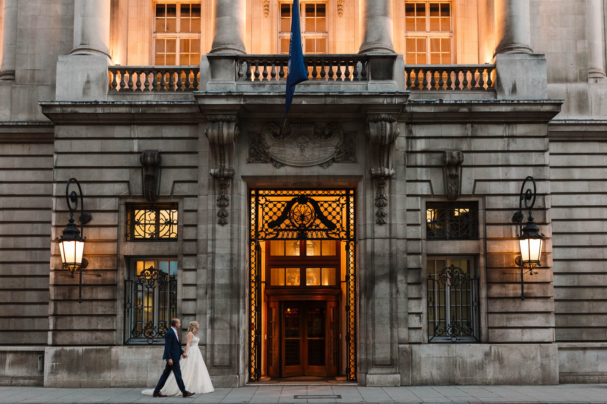 bride and groom entering RAC club wedding venue