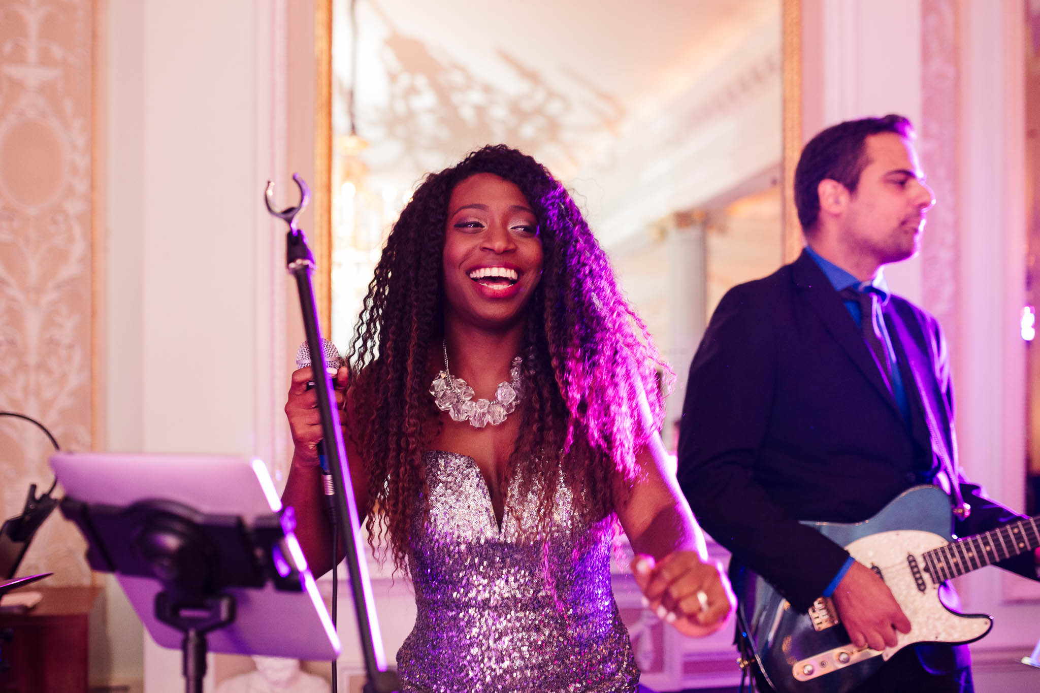 singer smiling at wedding
