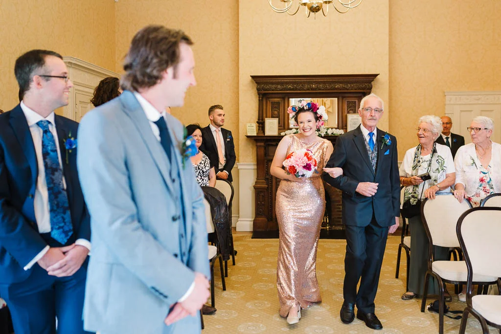 father walking bride down aisle
