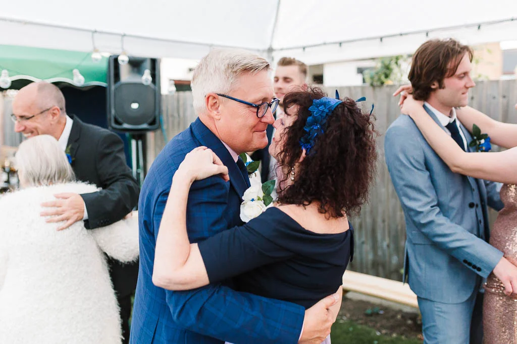 parents dancing at garden wedding