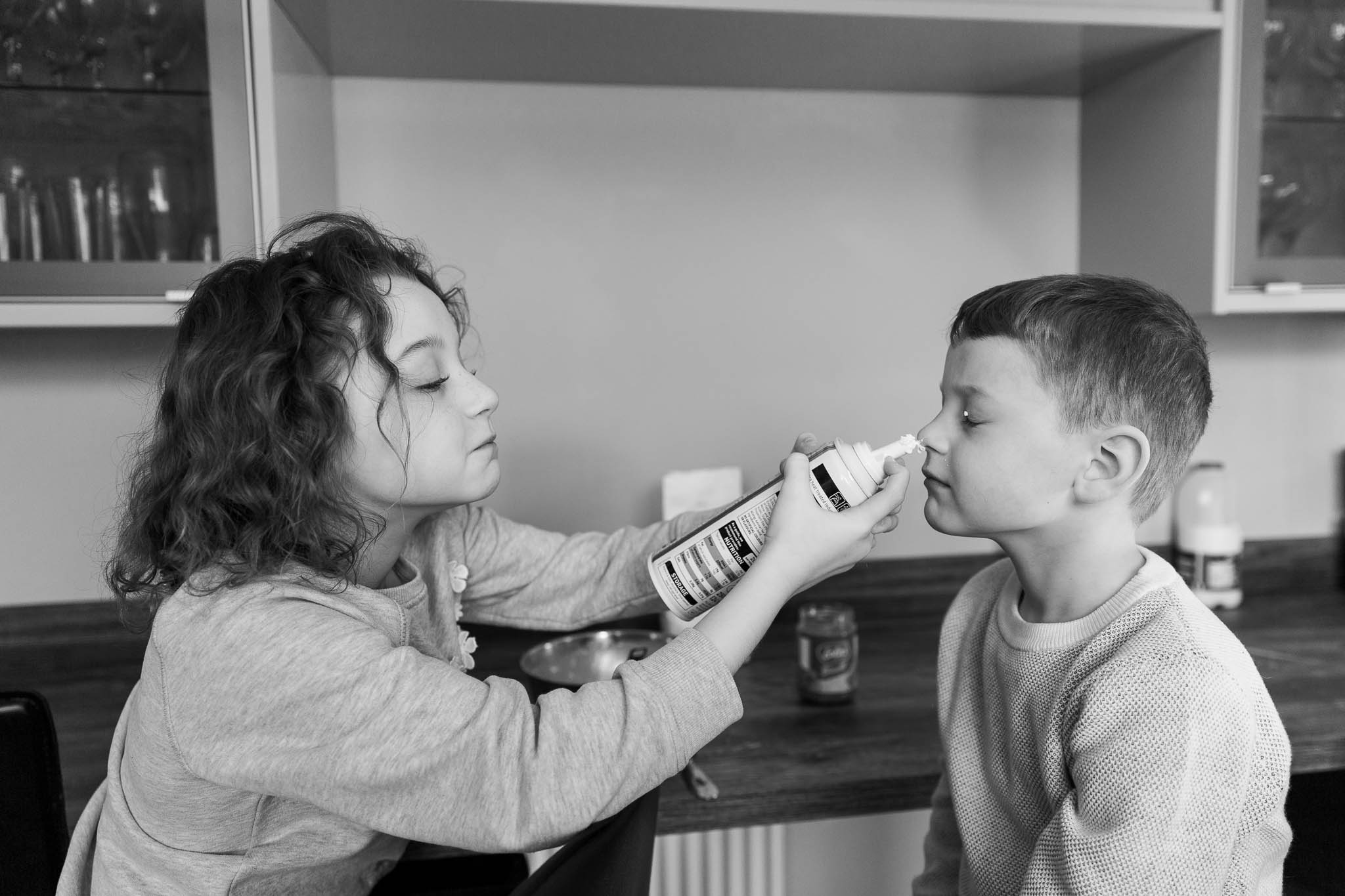 kids messing about making pancakes at home