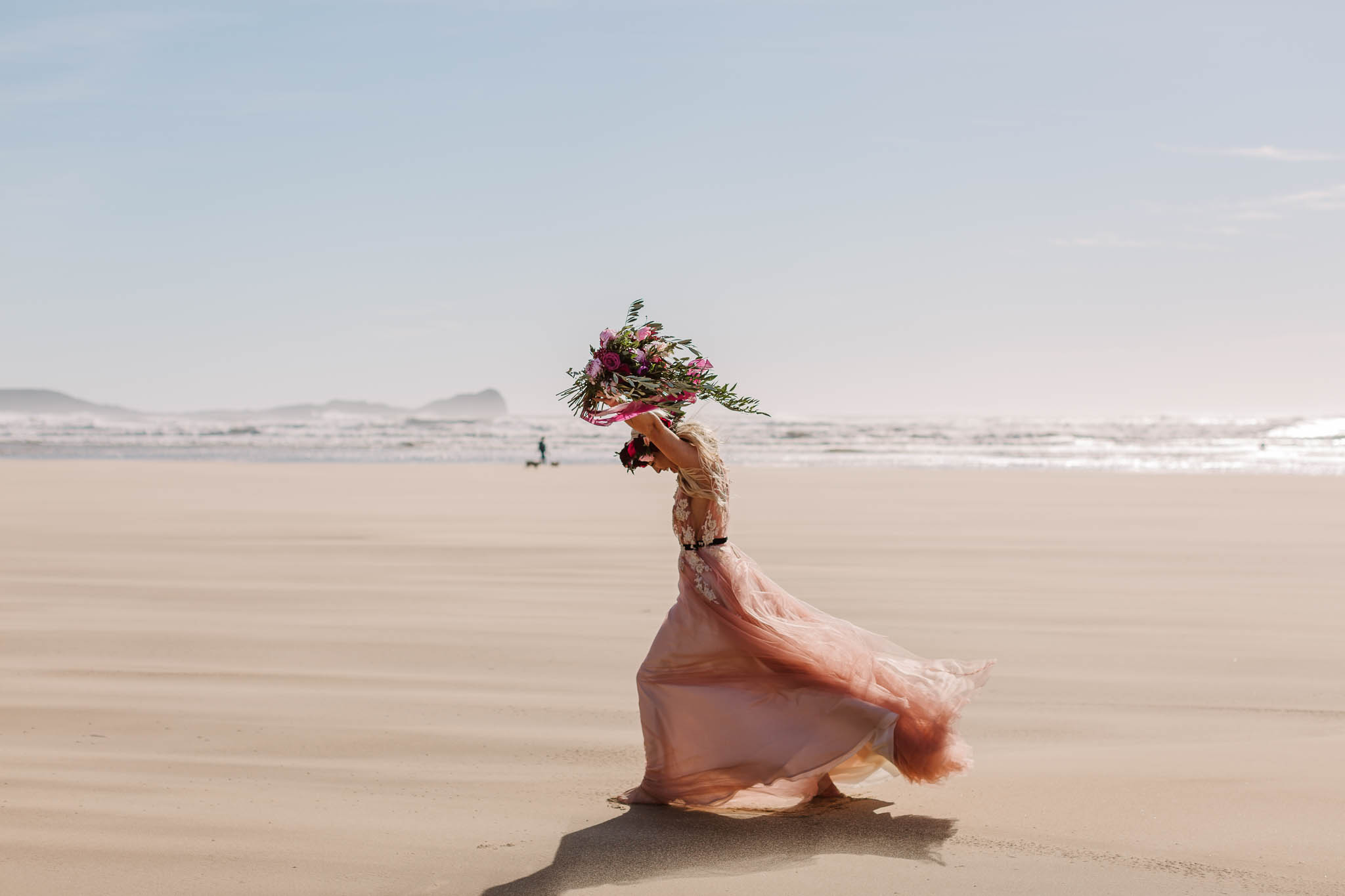 bride running on the beach