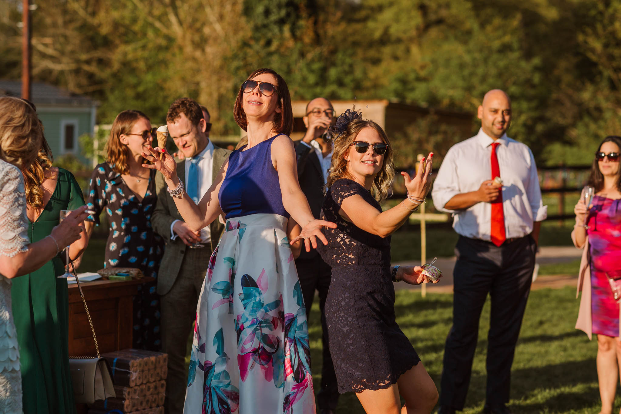 wedding guests dancing in the sun