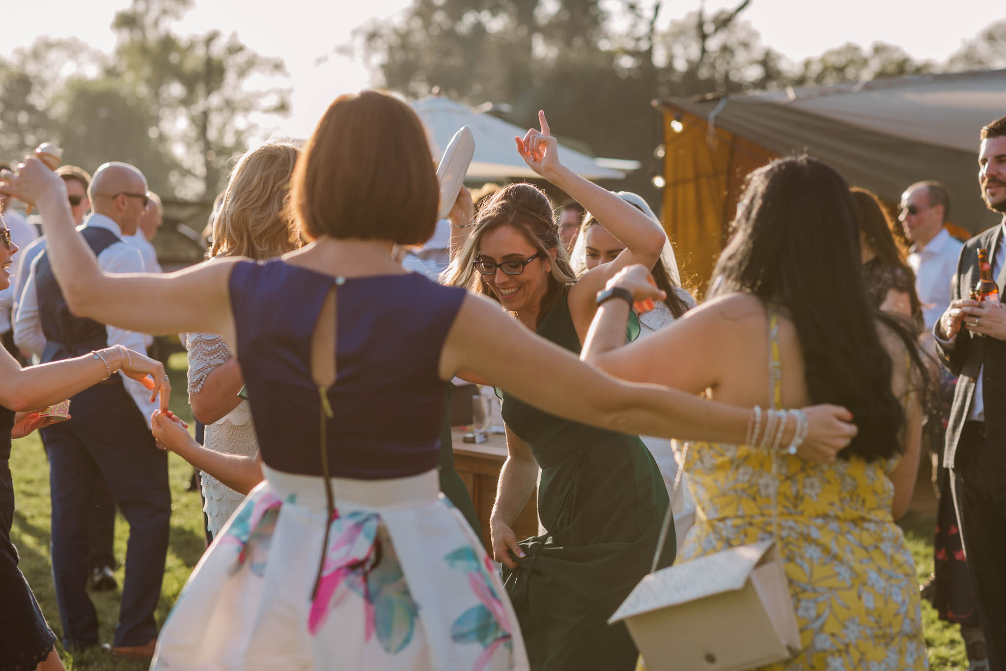 wedding guests dancing at festival style wedding