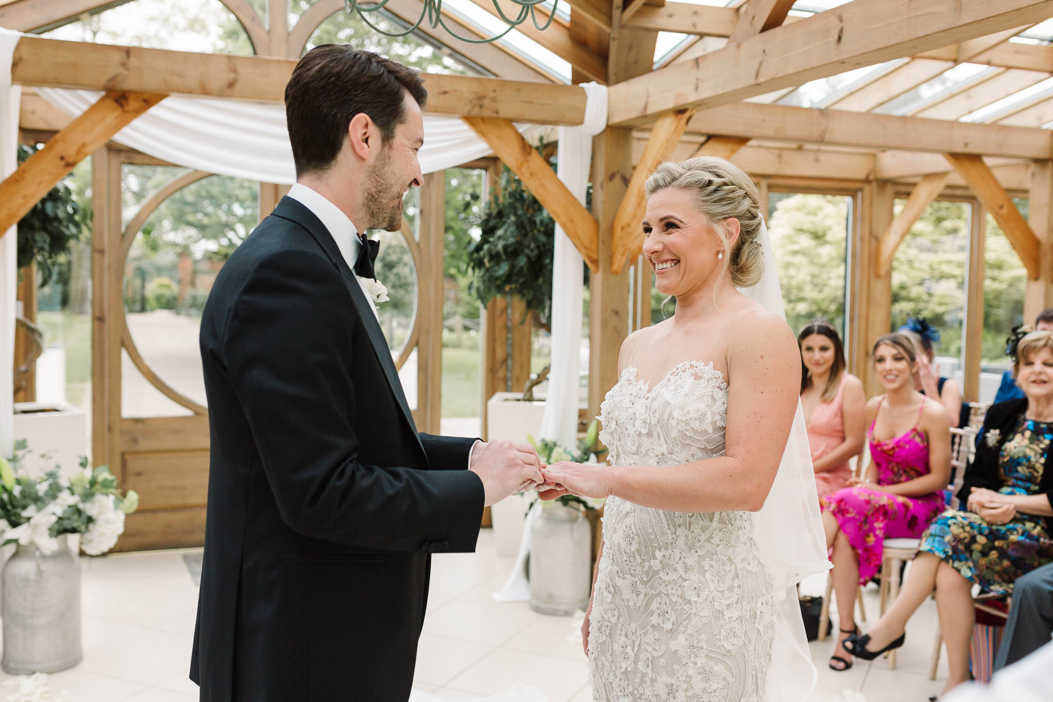 bride and groom saying vows at gaynes park