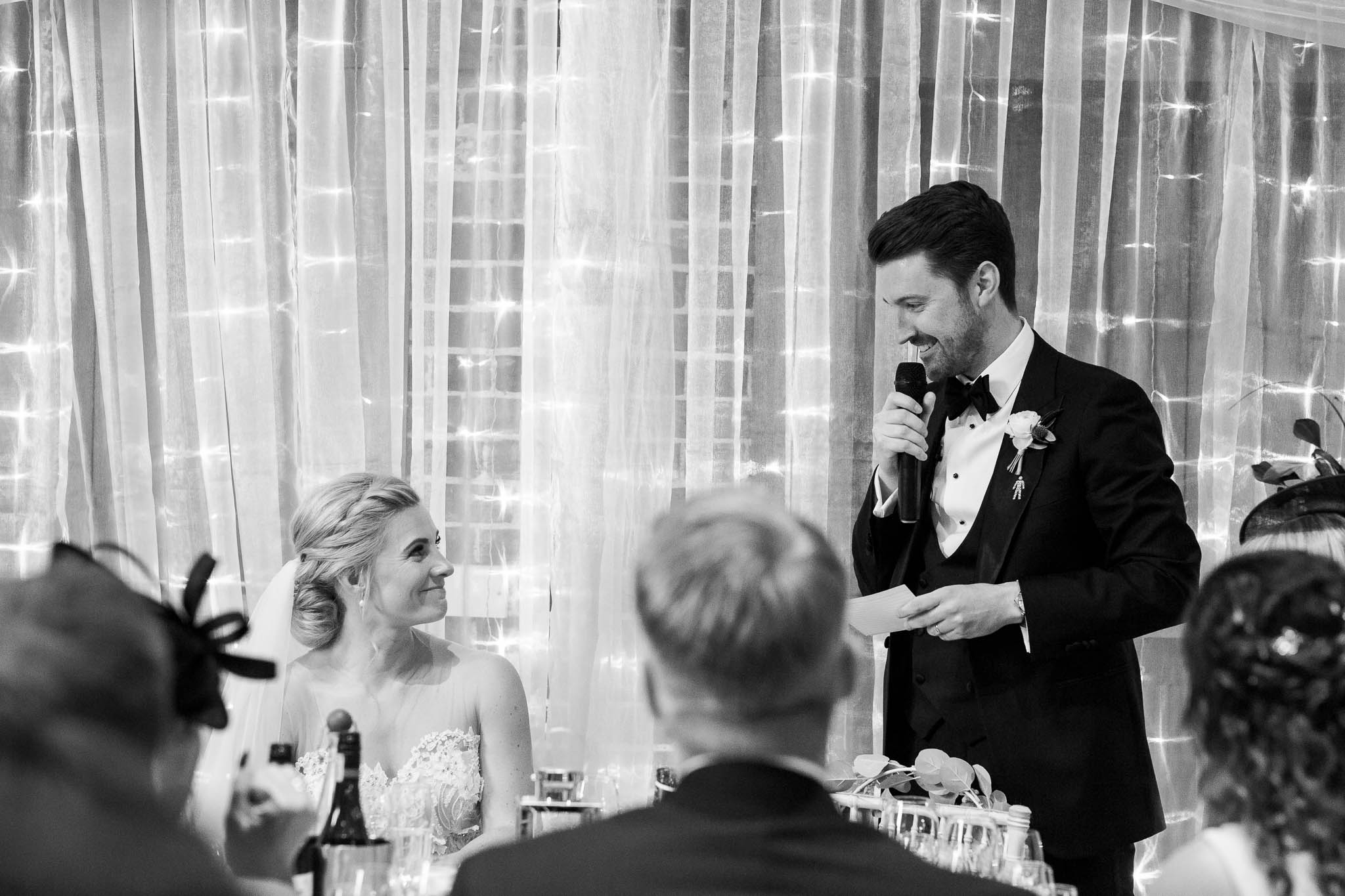 groom giving speech to new wife