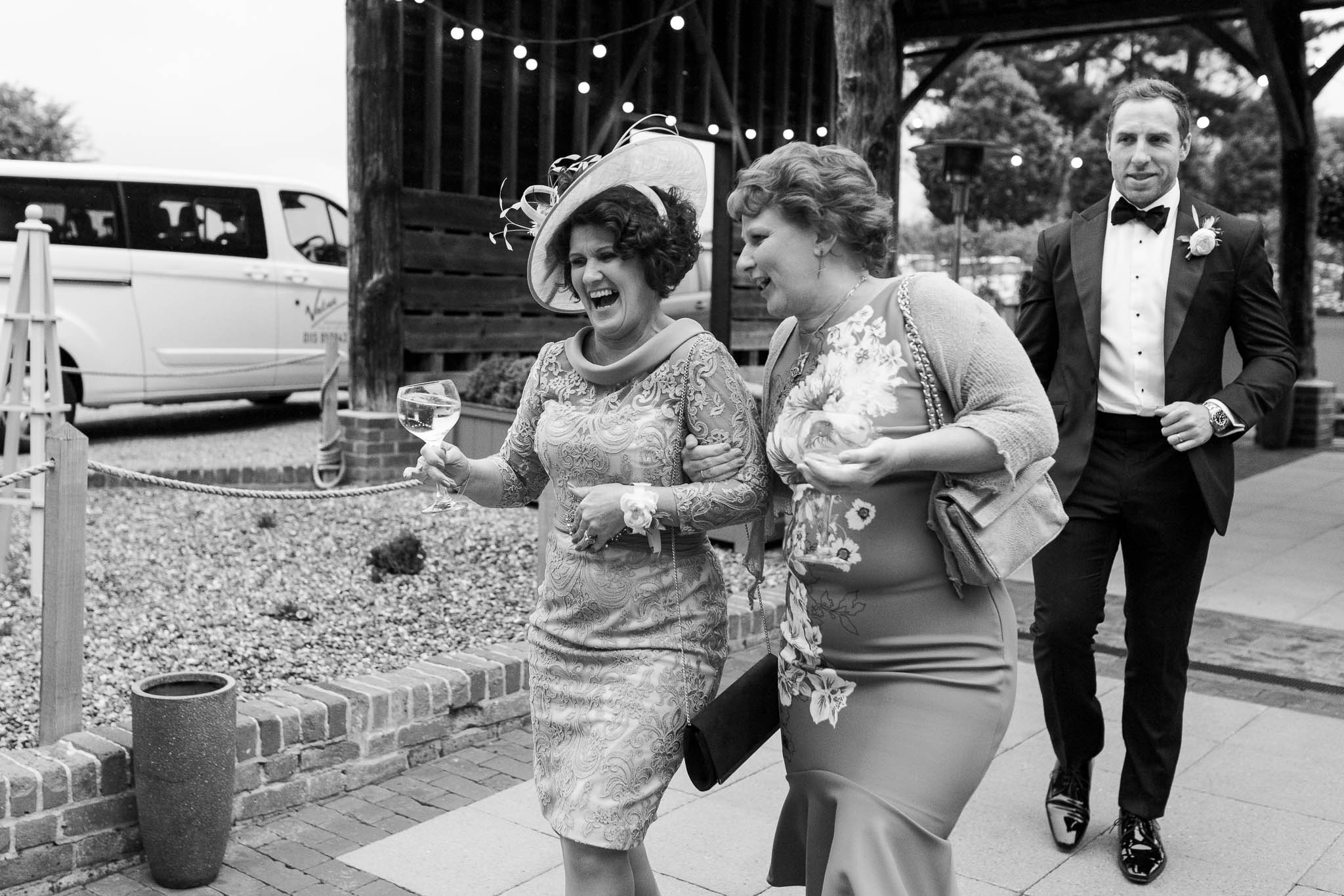 wedding guests laughing