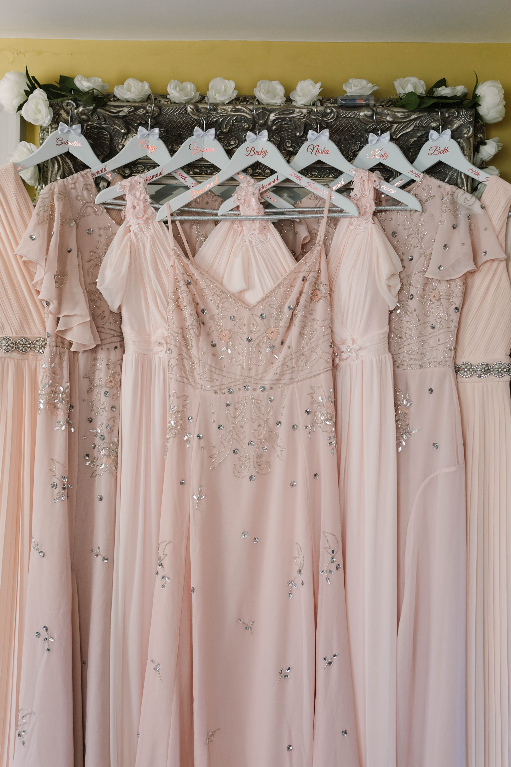 array of pink vintage bridesmaids dresses
