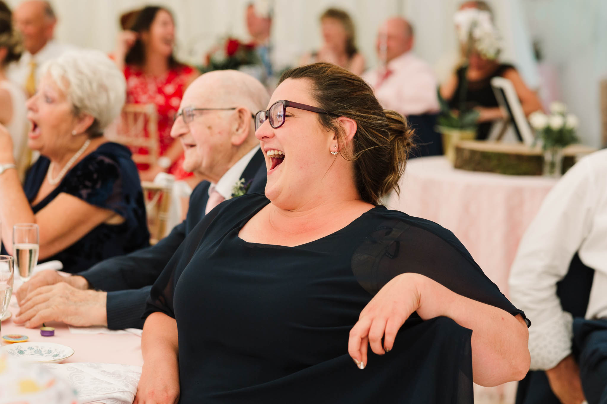 guest laughing at her seat