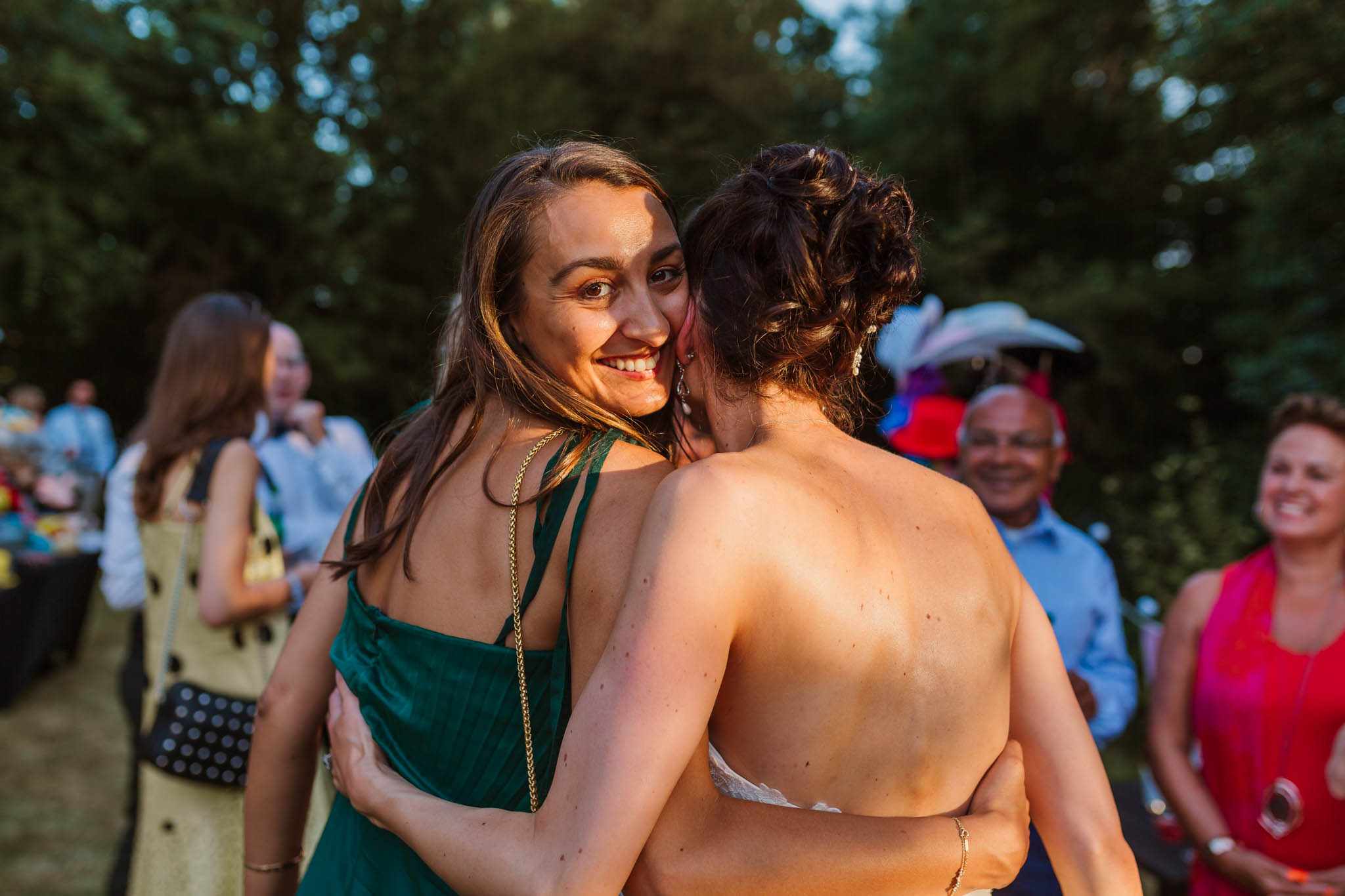 friend hugging bride