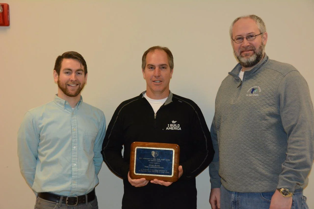 Pictured above: Marcus Smith of TCPWQ/ Chad Kuns of F&K Construction/Zach Beasley of TCPWQ