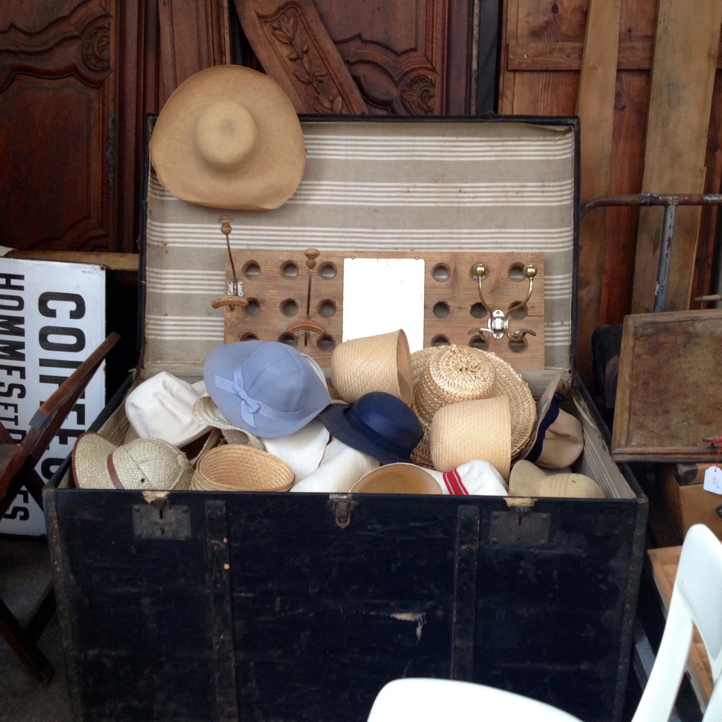 Trunk full of hats at l'Arrêt Deco. 