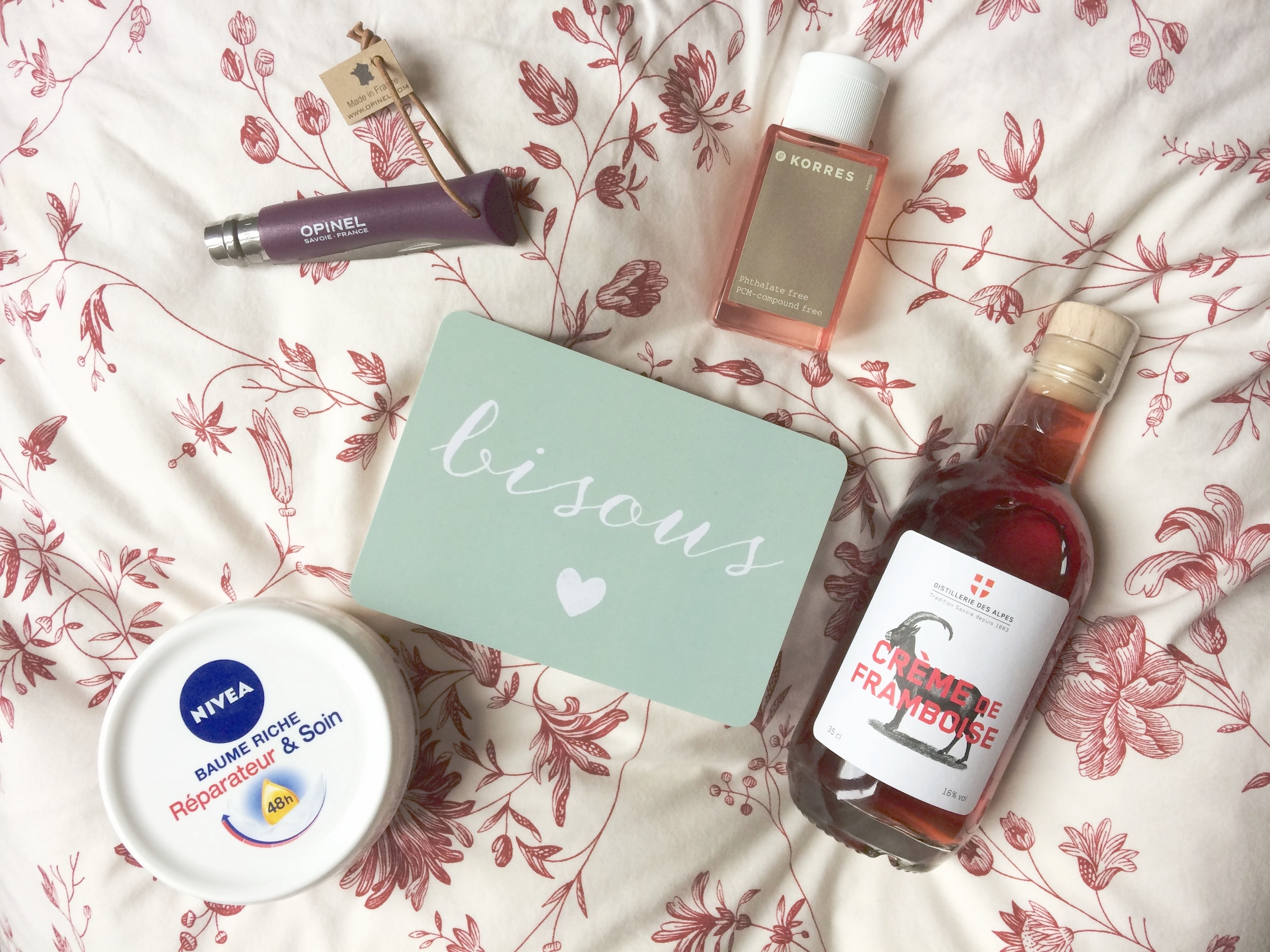 Clockwise from left: 1. Opinel no. 7 in plum // 2. Korres Bellflower Tangerine Pink Pepper eau de toilette // 3. Carte postale 'Bisous' from l'Instant Poétique // 4. Distillerie des Alpes Crème de framboise // 5. Nivea Baume Riche Réparateur & Soin