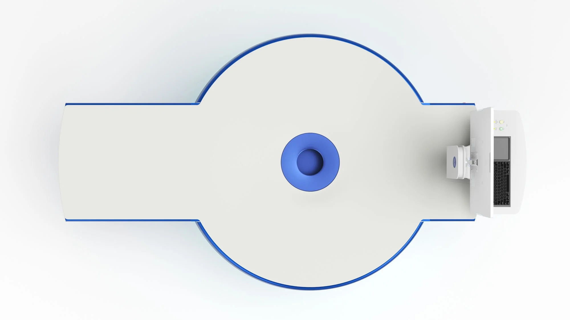 Overhead view of a CT scanner with a laptop and a small box on the side