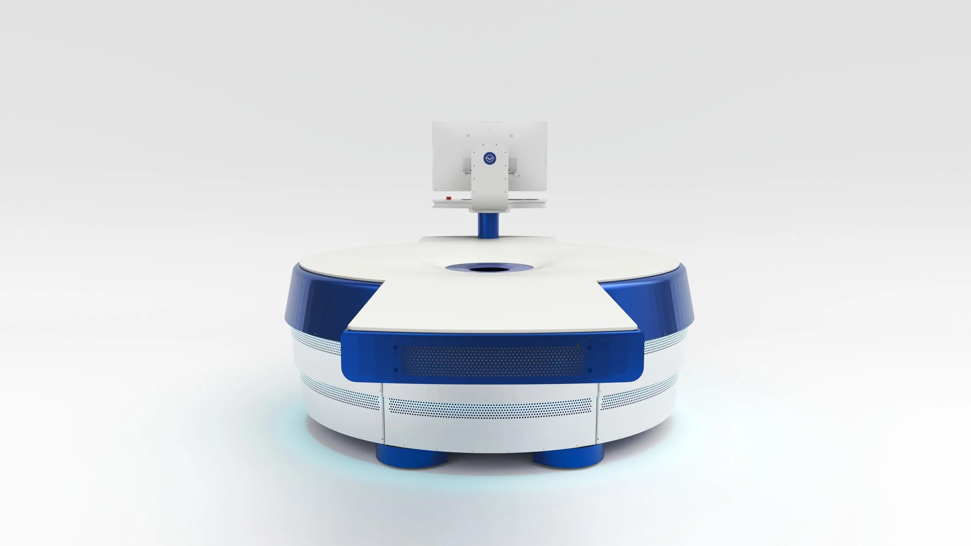 A robotic equipment with a round base and a vertical monitor or screen attached to a pole at the center.