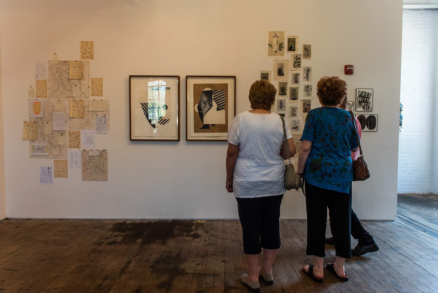Art enthusiasts look at works on display at Atlas Studios during Newburgh Open Studios on Saturday.