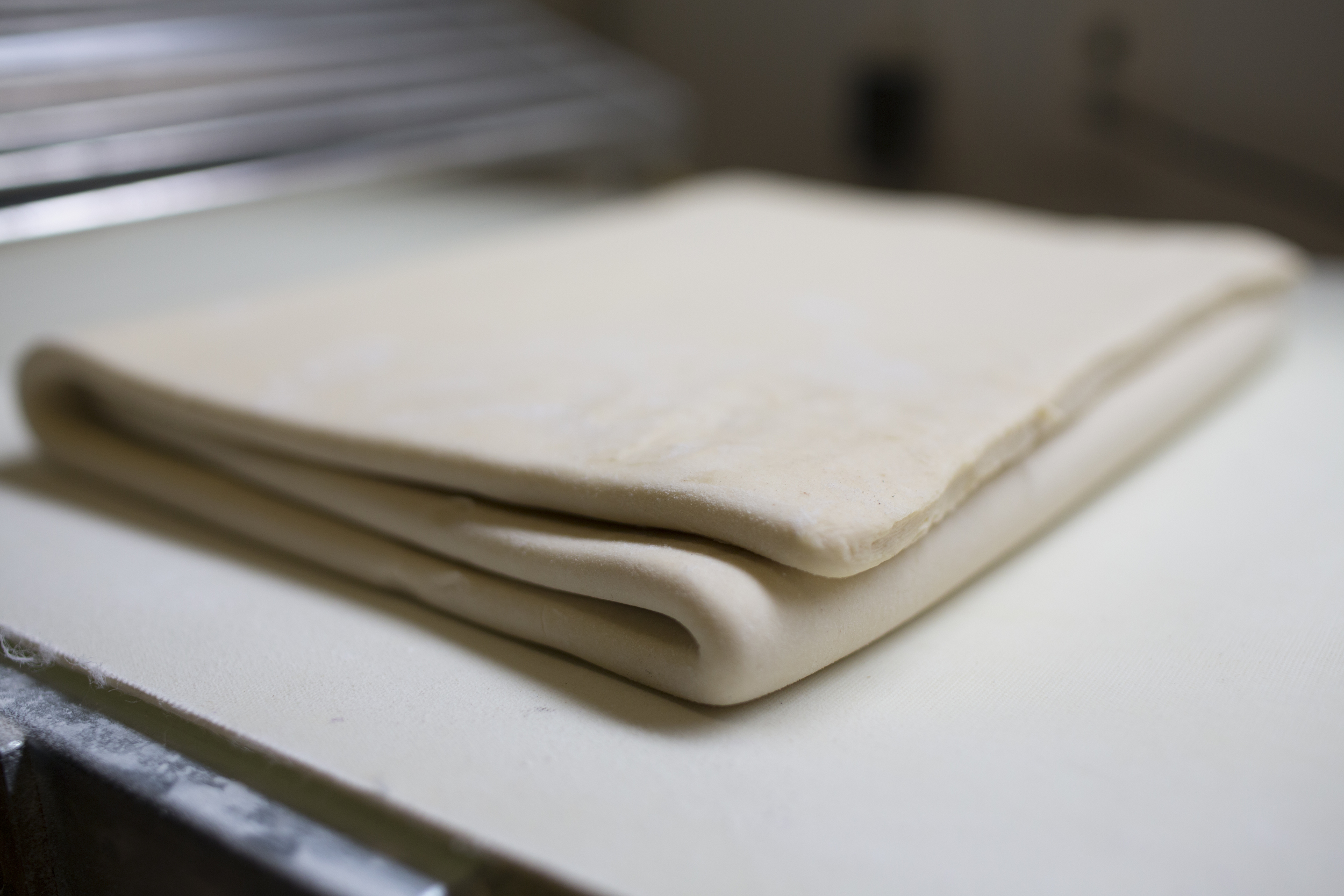 puff pastry being sheeted in the runner &amp; stone bakery