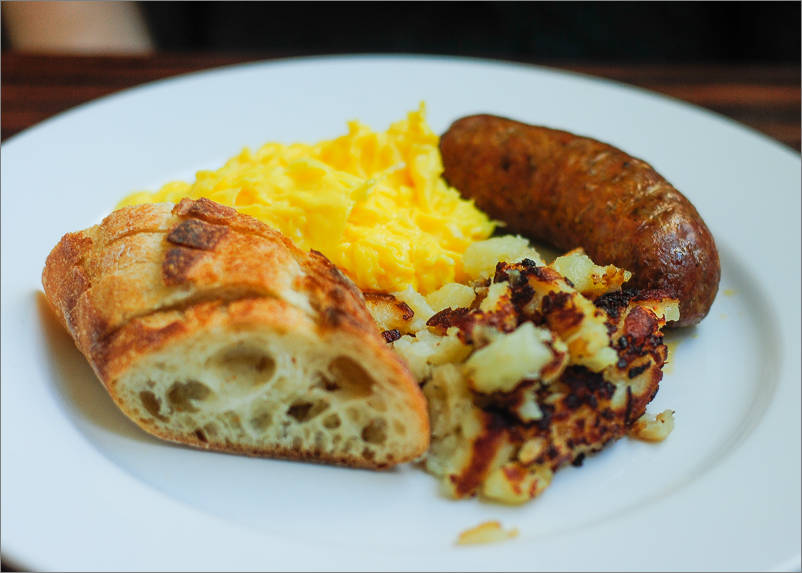 scrambled eggs, housemade breakfast sausage and potato hash