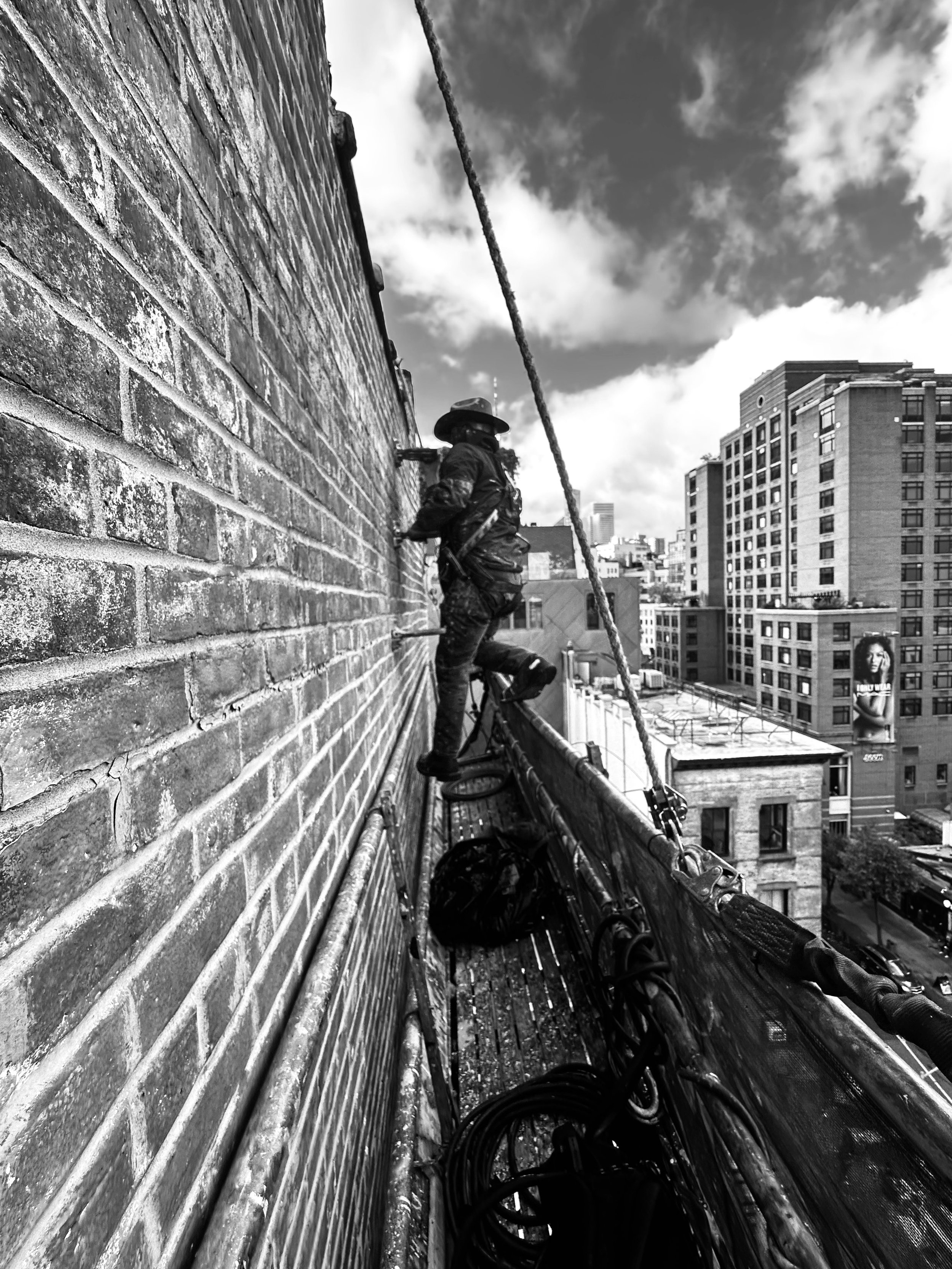  Artist Dave Shanessy at work over Grand St.  Manhattan, NYC 2025 