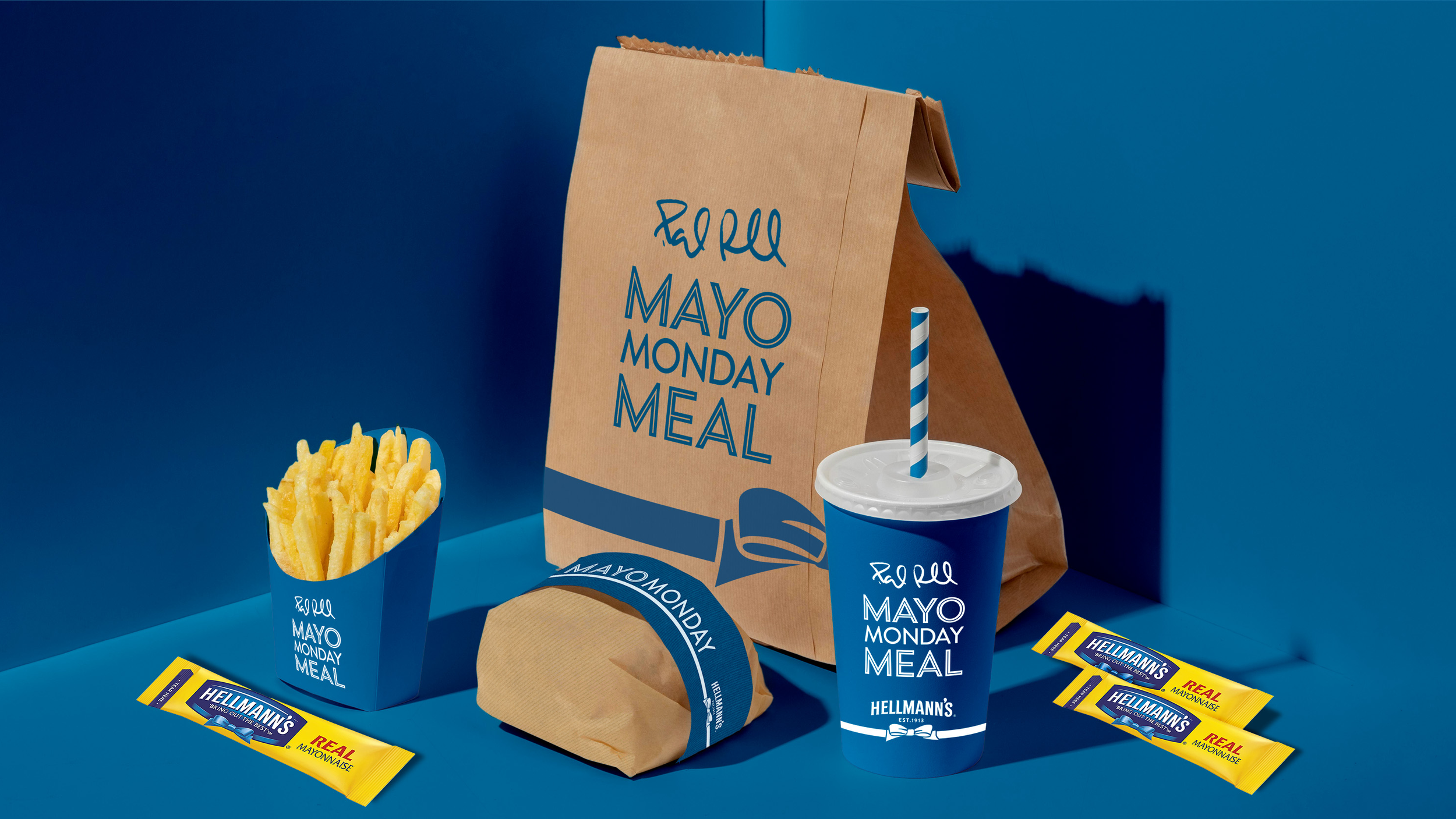 A limited fast food meal in custom packaging drawn from vintage lunchbox art, with bold color blocking and playful type.