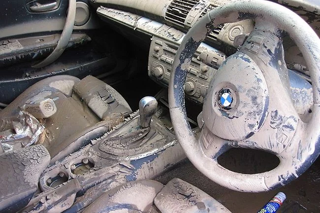 BMW interior destroyed by a climate related event, creating a increased demand for automotive fabric and production.