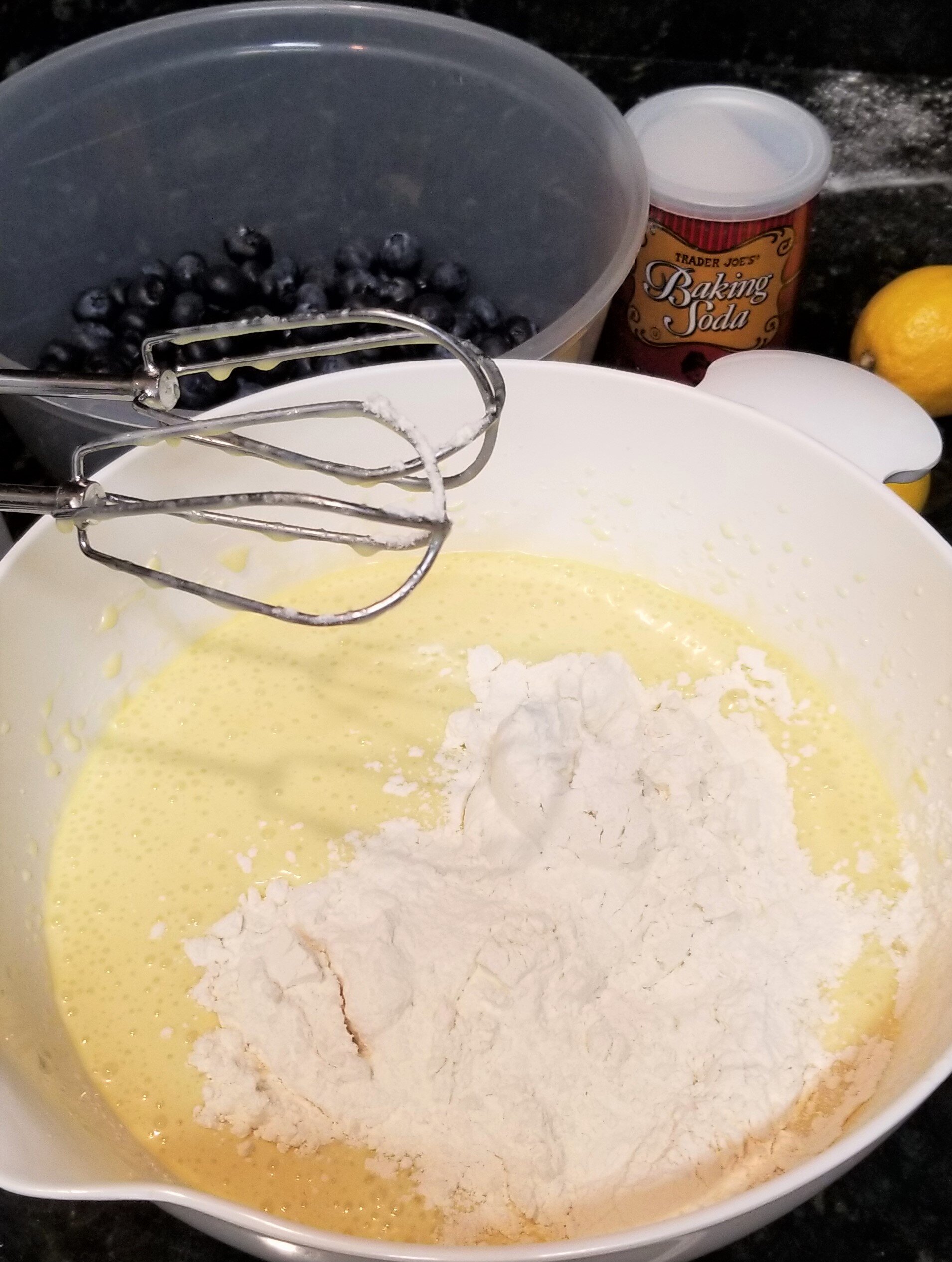 Adding flour to cake batter with an electric mixer