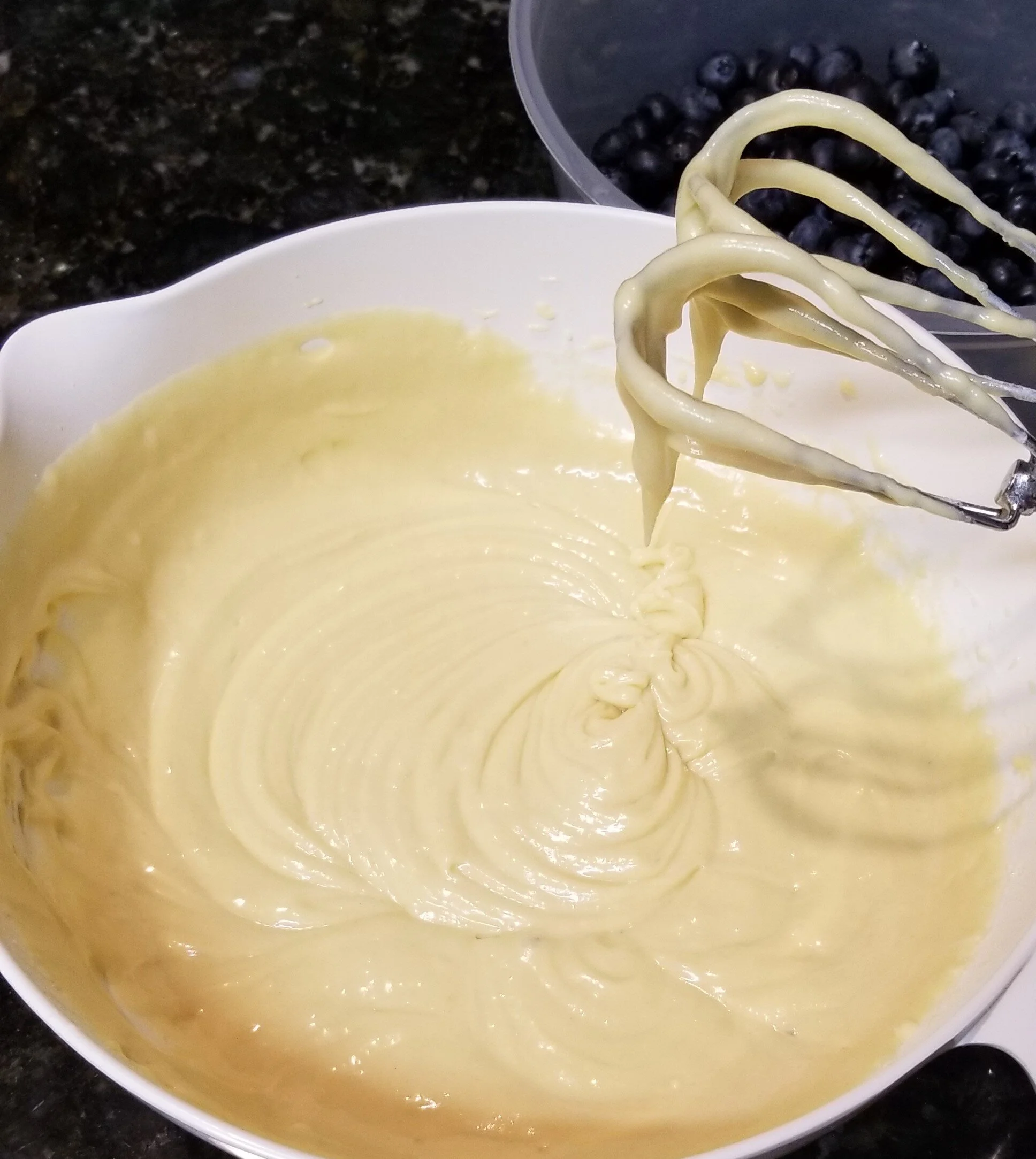 Adding lemon to a cake mix with an electric mixer