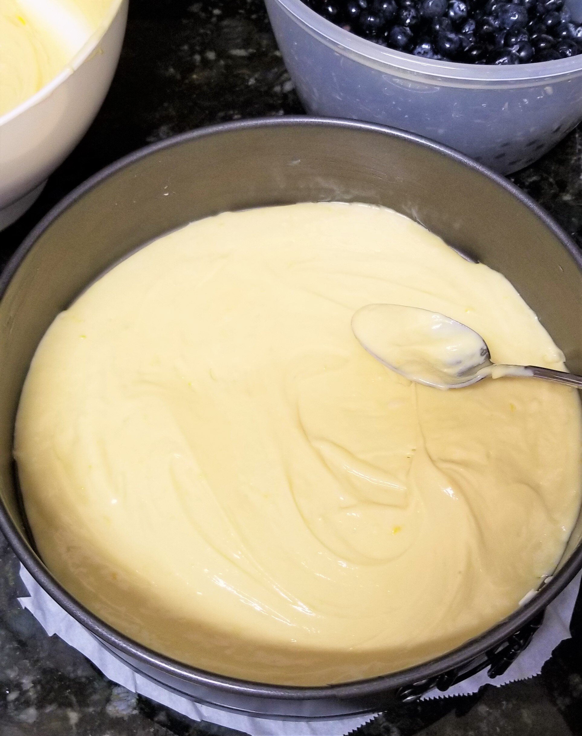 Adding cake batter into a spring form