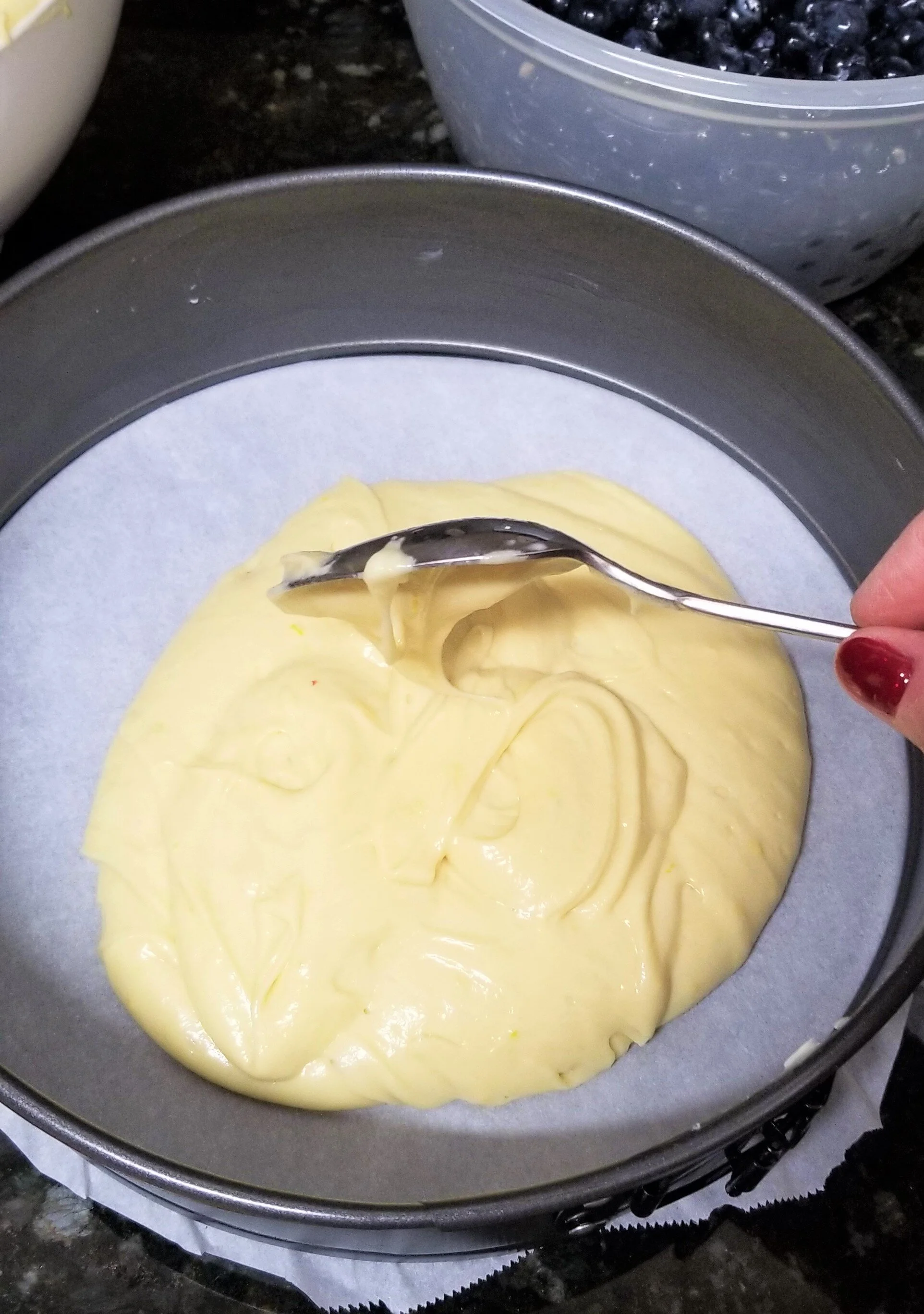 Pouring cake batter into spring form