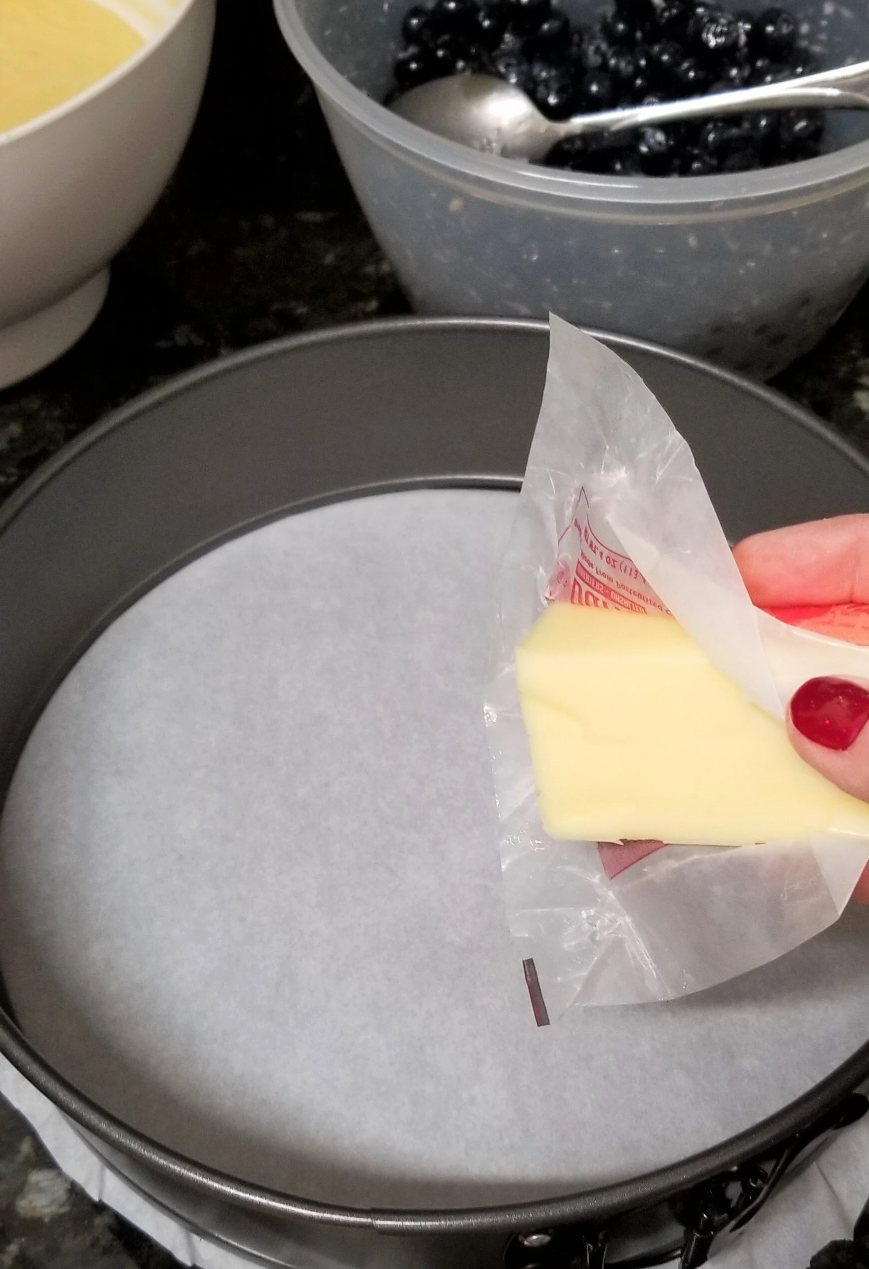 Rubbing butter onto a spring form